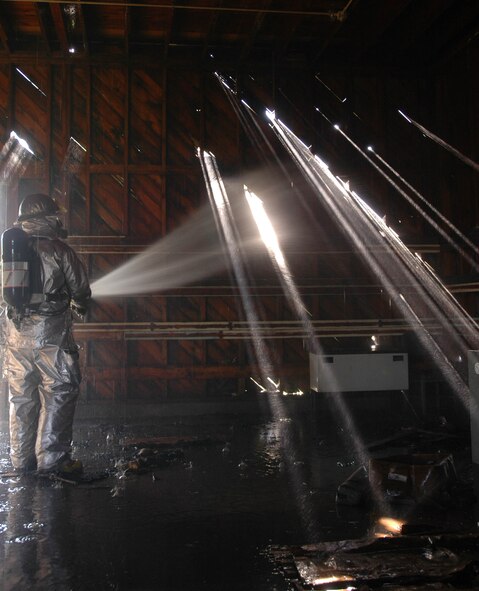 A 934th Airlift Wing firefighter puts his skills and equipment to the test during a Bivouac Oct. 3-5.  The Civil Engineer Squadron along with the Services Squadron participated in annual field training exercises conducted at the Arden Hills Army Training Site north of the Minneapolis base. (Air Force photo/Staff Sgt. Michael Edmond)