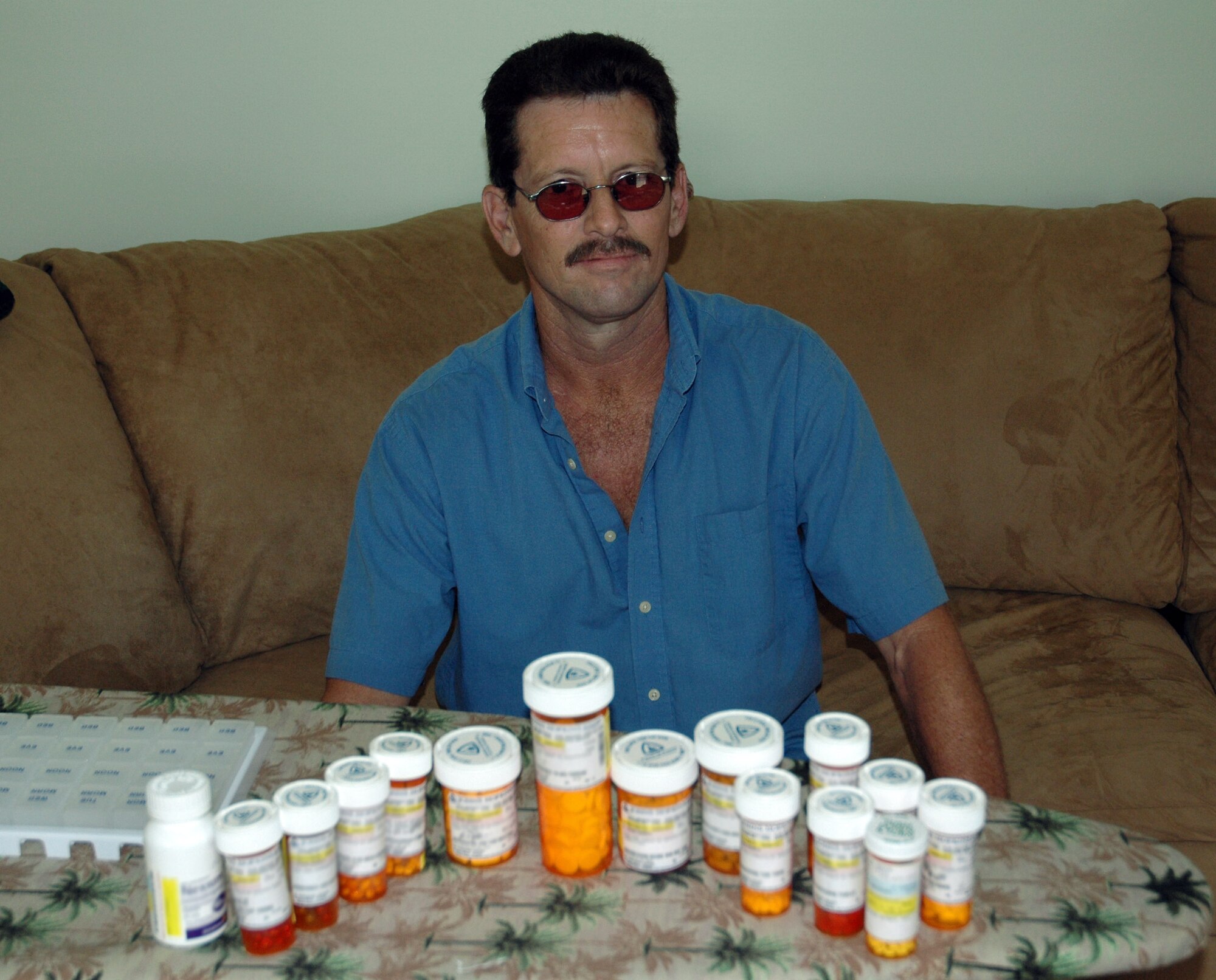 Staff Sgt. Mark Shortt displays the takes 15 medications he takes six times a day at his home in Dover, Del. He underwent a kidney transplant Sept. 22 at John Hopkins Hospital in Baltimore. In 2006, he'd contracted a viral antibody, which attacked both his kidneys leading to their failure in August 2007. Now that he's had the transplant, he is off dialysis but must take medication for the rest of his life. He is a supply technician with the Air Force Reserve's 512th Civil Engineer Squadron at Dover Air Force Base, Del. (U.S. Air Force photo/Capt. Marnee A.C. Losurdo)