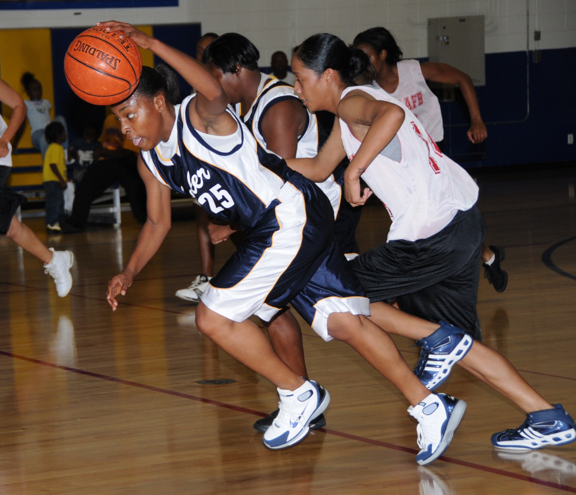 Keesler’s Sonderia Brown powers down the court with Edna Padilla of Shaw Air Force Base, S.C., in hot pursuit during the Southeastern Military Athletic Conference’s women’s preseason tournament, Saturday at Blake Fitness Center.  The Lady Dragons won this game in the second round, 87-50, after posting a 75-44 victory against Fort Benning, Ga., in the first round.  Keesler was trounced in the third round by Tyndall AFB, Fla., 87-57, and lost to Eglin AFB, Fla., 77-70, in the Lady Dragons’ final game.  Tyndall won the tournament, followed by Eglin in second place and Keesler in third.  (U.S. Air Force photo by Kemberly Groue)