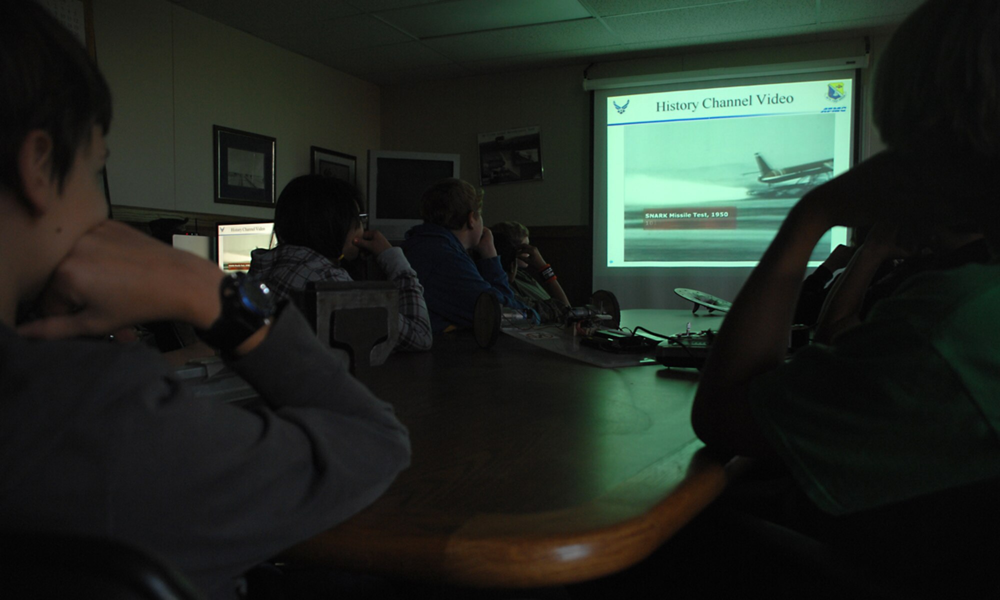 Children from Mountain View Middle School watch a video from the History Channel about the 846th Test Squadron during a recent visit to Holloman Air Force Base, N.M., October 8. Personnel from the 846th are helping the children in a robotics competition that will be held November 1 in Laas Cruces, N.M. (U.S. Air Force photo/ Senior Airman Tiffany Trojca) 