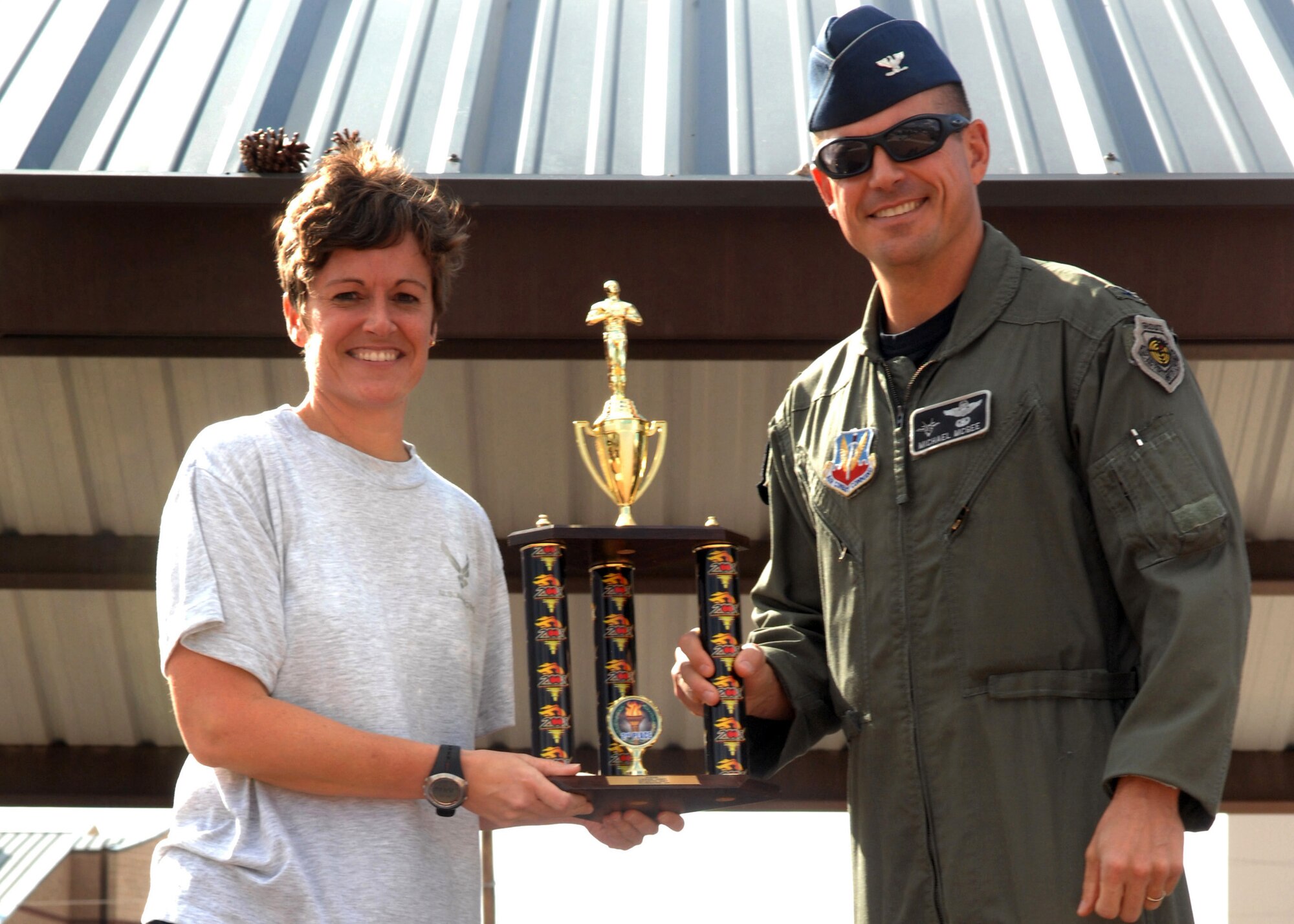Lt. Col. Melissa Batten, 49th Logistics Readiness Squadron commander, receives second place (Large Squadron award) from Col. Michael McGee, 49th Fighter Wing vice commander, at Holloman Air Force Base, N.M., October 10. Awards were presented to winning squadrons who participated during Sports Day. (U.S. Air Force photo/Airman 1st Class Veronica Salgado)