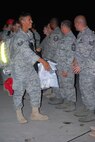 About 110 Airmen from the 556th REDHORSE Squadron returned from deployment on Sunday, October 12, 2008. When the Reserve Airmen arrived home, about 300 friends, family and unit members were there to welcome them with hugs and hand-made banners. REDHORSE is an acronym for Rapid Engineer Deployable Heavy Operational Repair Squadron Engineers. The REDHORSE Airmen deployed to three different countries within the U.S. Central Command Area of Responsibility. During the deployment, they dug wells for Afghanis, repaired existing structures in Iraq and supported base construction and repair needs throughout the AOR. The 556th REDHORSE Squadron is due to relocate to Florida later this year but many of the Reservists will remain at Lackland Air Force Base as new members of the 433rd Civil Engineer Squadron. (U.S. Air Force Photo/Master Sgt. Collen McGee) 