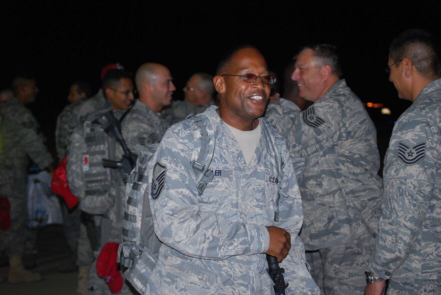 About 110 Airmen from the 556th REDHORSE Squadron returned from deployment on Sunday, October 12, 2008. When the Reserve Airmen arrived home, about 300 friends, family and unit members were there to welcome them with hugs and hand-made banners. 
REDHORSE is an acronym for Rapid Engineer Deployable Heavy Operational Repair Squadron Engineers. The REDHORSE Airmen deployed to three different countries within the U.S. Central Command Area of Responsibility. During the deployment, they dug wells for Afghanis, repaired existing structures in Iraq and supported base construction and repair needs throughout the AOR. 
The 556th REDHORSE Squadron is due to relocate to Florida later this year but many of the Reservists will remain at Lackland Air Force Base as new members of the 433rd Civil Engineer Squadron. (U.S. Air Force Photo/Master Sgt. Collen McGee) 
