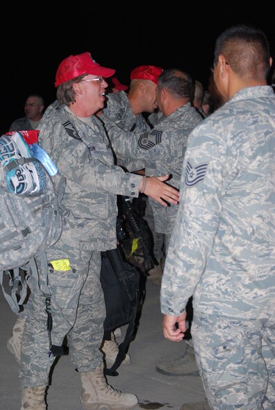 About 110 Airmen from the 556th REDHORSE Squadron returned from deployment on Sunday, October 12, 2008. When the Reserve Airmen arrived home, about 300 friends, family and unit members were there to welcome them with hugs and hand-made banners. REDHORSE is an acronym for Rapid Engineer Deployable Heavy Operational Repair Squadron Engineers. The REDHORSE Airmen deployed to three different countries within the U.S. Central Command Area of Responsibility. During the deployment, they dug wells for Afghanis, repaired existing structures in Iraq and supported base construction and repair needs throughout the AOR. The 556th REDHORSE Squadron is due to relocate to Florida later this year but many of the Reservists will remain at Lackland Air Force Base as new members of the 433rd Civil Engineer Squadron. (U.S. Air Force Photo/Master Sgt. Collen McGee) 