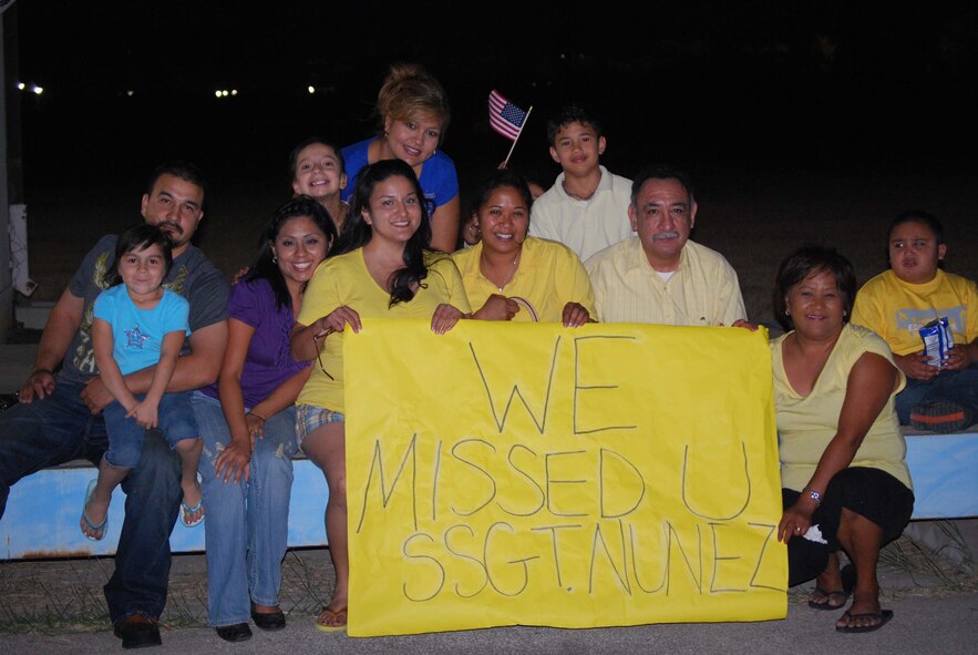 About 110 Airmen from the 556th REDHORSE Squadron returned from deployment on Sunday, October 12, 2008. When the Reserve Airmen arrived home, about 300 friends, family and unit members were there to welcome them with hugs and hand-made banners. REDHORSE is an acronym for Rapid Engineer Deployable Heavy Operational Repair Squadron Engineers. The REDHORSE Airmen deployed to three different countries within the U.S. Central Command Area of Responsibility. During the deployment, they dug wells for Afghanis, repaired existing structures in Iraq and supported base construction and repair needs throughout the AOR. The 556th REDHORSE Squadron is due to relocate to Florida later this year but many of the Reservists will remain at Lackland Air Force Base as new members of the 433rd Civil Engineer Squadron. (U.S. Air Force Photo/Master Sgt. Collen McGee) 
