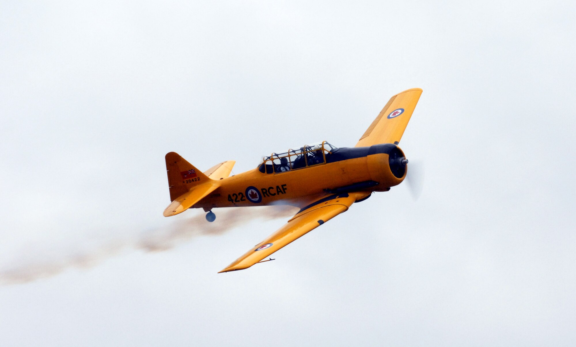 A T-6A Texan II flies over Moton Field during the grand opening of the Tuskegee Airmen National Historic Site Oct. 11 in Tuskegee, Ala. Moton Field in the 1940s was the only primary flight training facility for the first African American pilot candidates in the Army Air Corps, these pilots are known as the Tuskegee Airmen. (U.S. Air Force photo/Staff Sgt. Christine Jones)
