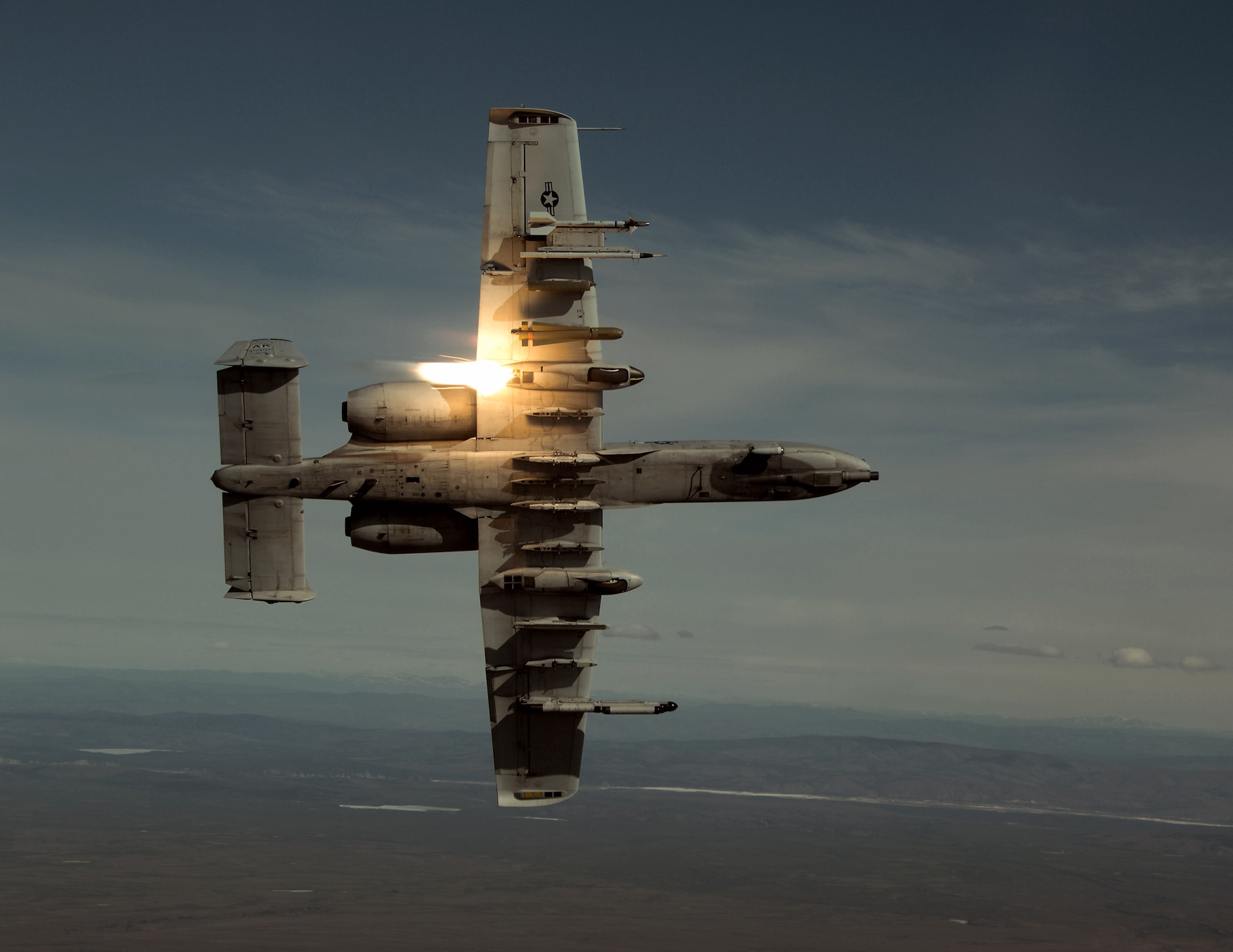 An A-10 Thunderbolt II, like this one, performs sorties daily providing top cover for ground forces in Southwest Asia.  A-10s provide close-air support and employ a wide variety of conventional munitions, including general purpose bombs, cluster bombs units and laser guided bombs. (U.S. Air Force photo/Master Sgt. Robert Wieland)