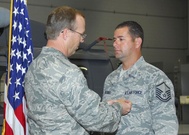 Master Sgt. Darrin Goetchius, 763rd Maintenance Squadron production superintendent, receives a Bronze Star Medal from Lt. Col. Richard Donnelly, 563rd Rescue Group Operating Location Alpha deputy commander, on October 9, 2008 for meritorious service in support of Operation Iraqi Freedom. Sergeant Goetchius was deployed to Taji, Iraq from May 2007-2008. (U.S Air Force photo by Staff Sgt. Taylor Worley)