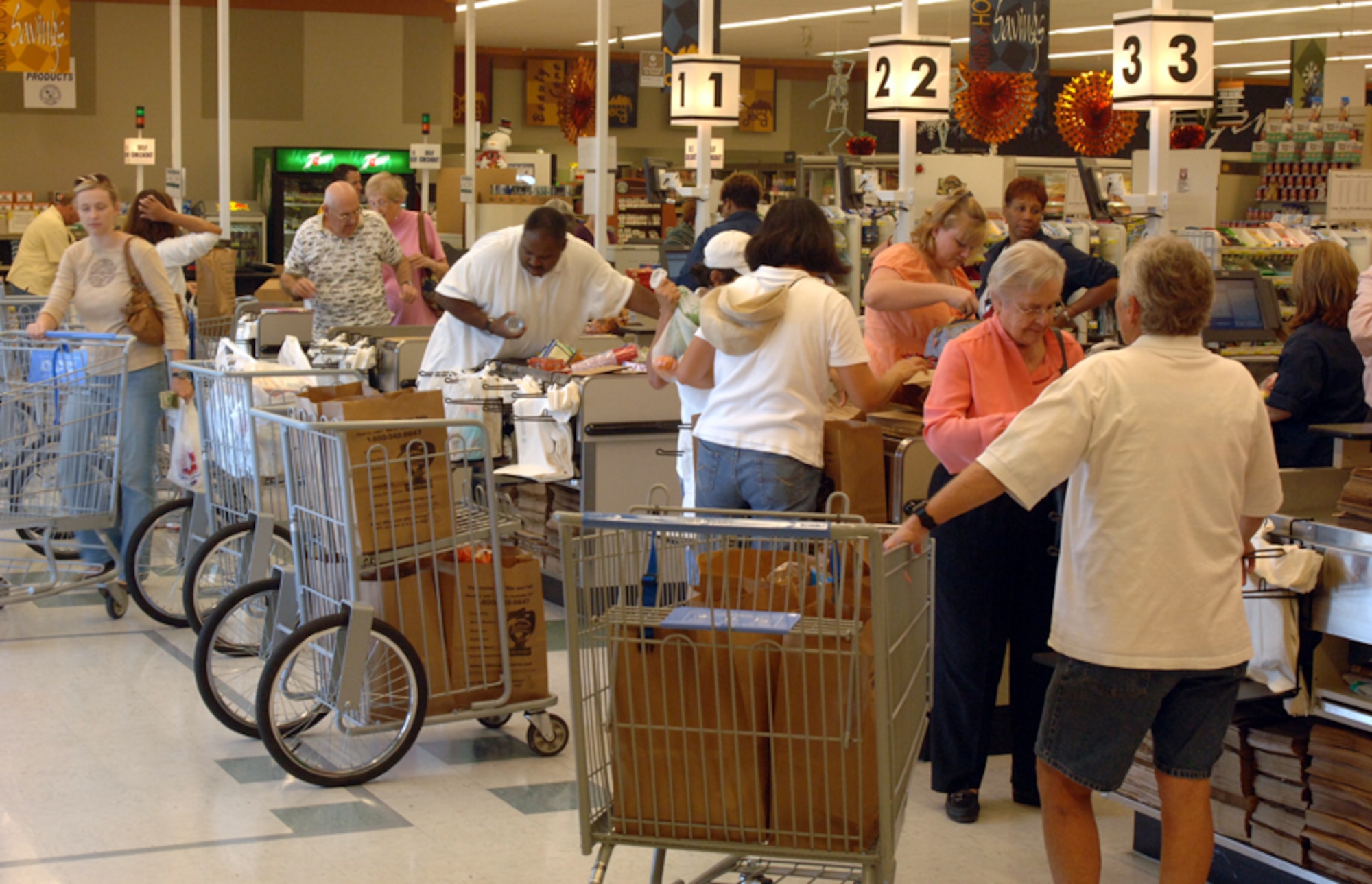 The Columbus AFB Commissary staff works diligently to ensure speedy service to its patrons during a morning rush. (U.S. Air Force photo by Airman Josh Harbin)
