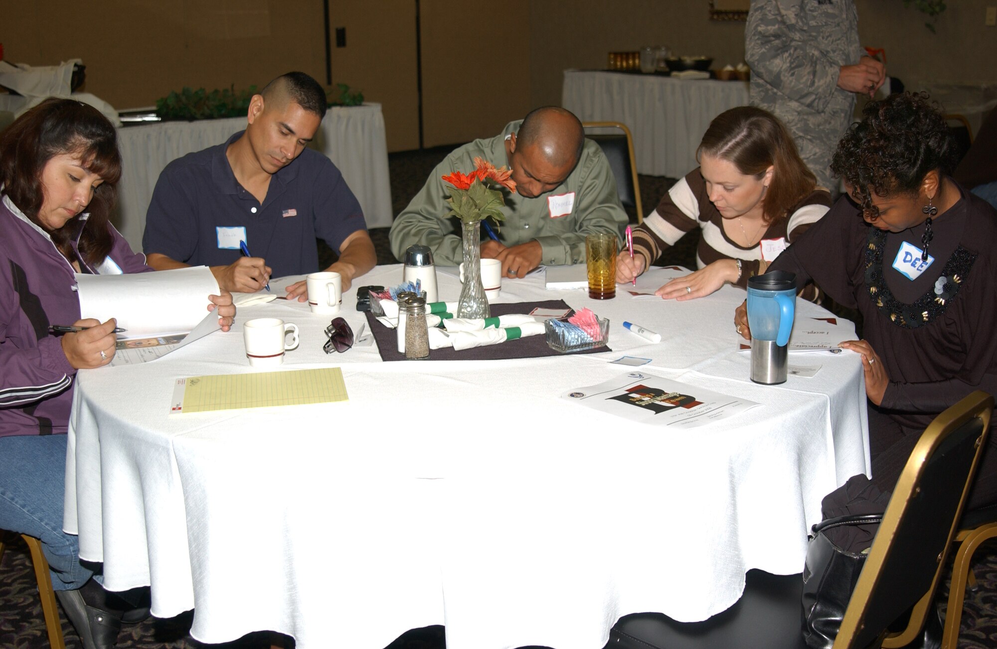 SCOTT AIR FORCE BASE, Ill. -- JTF Scott couples write letters to their spouses about things that they do not necessarily like, but accept about the spouse and things that they appreciate about their spouse and then read them aloud to their spouses. Couples with various years of marriage and even spouses attending alone invested time in enhancing their marriages at the “Building a Strong Marriage Team” seminar, which is part of the Marriage Enrichment Program, Oct. 9 at the National Shrine of Our Lady of the Snows in Belleville, Ill. Attendees spent the day learning from Chaplain (Capt.) Neely Brown, 375th Airlift Wing Reserve chaplain, about their personality types, what their responsibilities are in a marriage and the importance of spending time together to have better marriages. 
(U.S. Air Force photo/Airman 1st Class Amber Kelly-Woodward)
