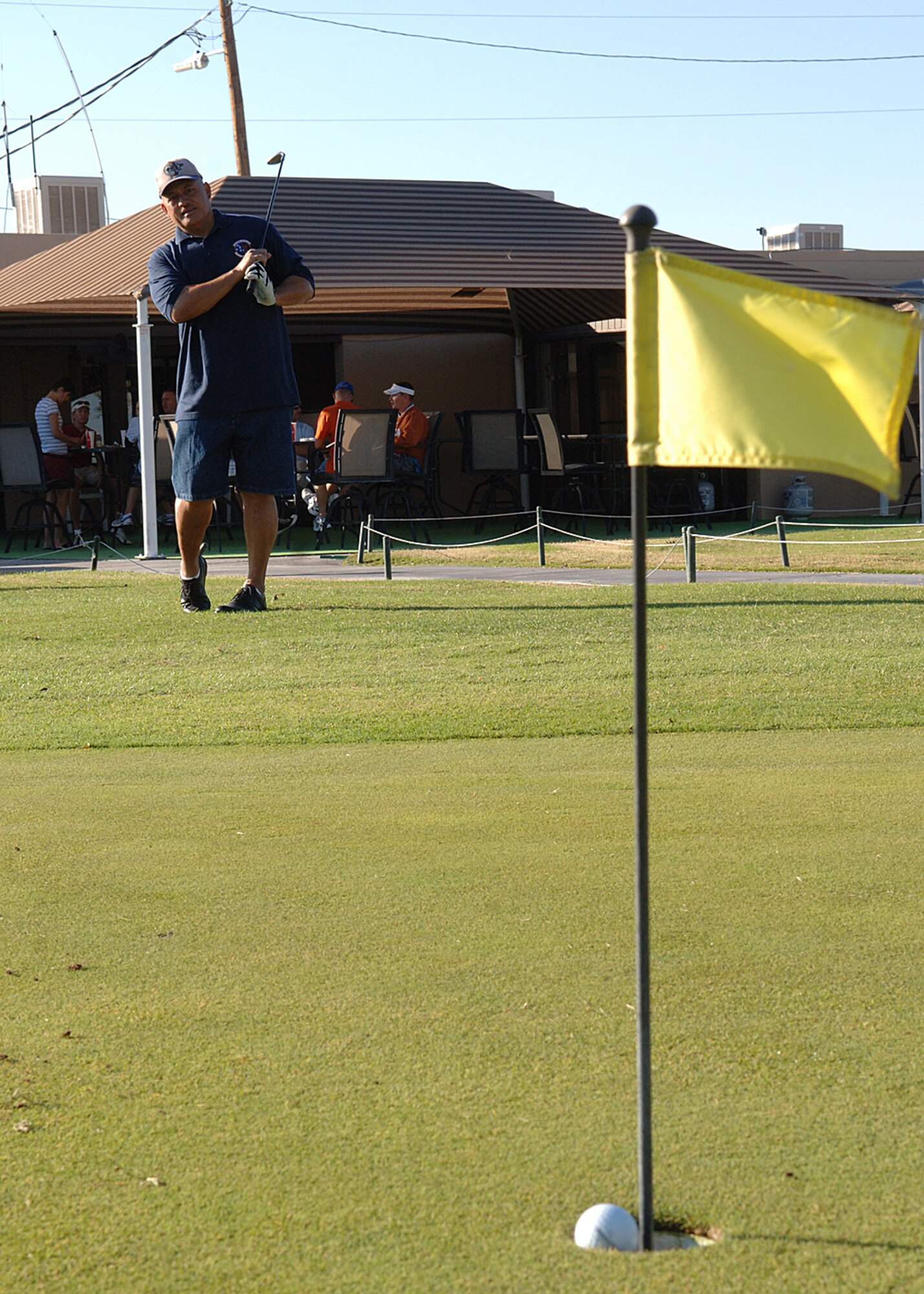 Chief Master Sgt. Luamata Faiai, 49th Logistics Readiness Squadron, practices his swing during Sports Day, October 10, at the Golf Course at Holloman Air Force Base, N.M. The Fitness and Sports Center held 15 events and over 2000 Team Holloman members participated in the events. (U.S. Air Force photo/Airman 1st Class John D. Strong II) 