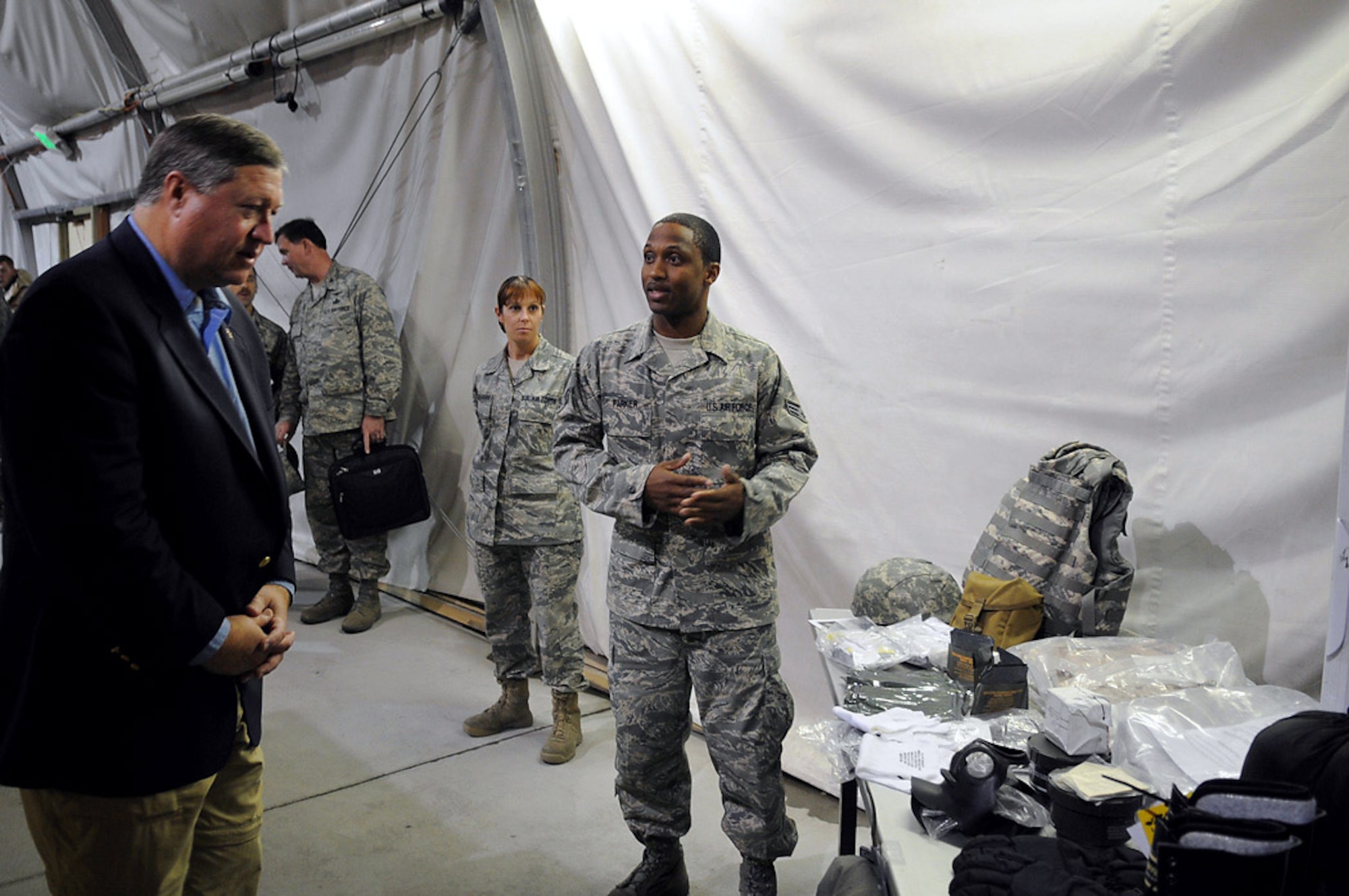 Senior Airman Sean Parker briefs Secretary of the Air Force Michael B. Donley about the Expeditionary Theater Distribution Center Oct.15 at Manas Air Base, Kyrgyzstan. Manas AB was the final stop in the secretary's first trip to the U.S. Air Forces Central area of responsibility. Airman Parker is assigned to the 376th Expeditionary Theater Distribution Center. (U.S. Air Force photo/Senior Airman Ruth Holcomb) 
