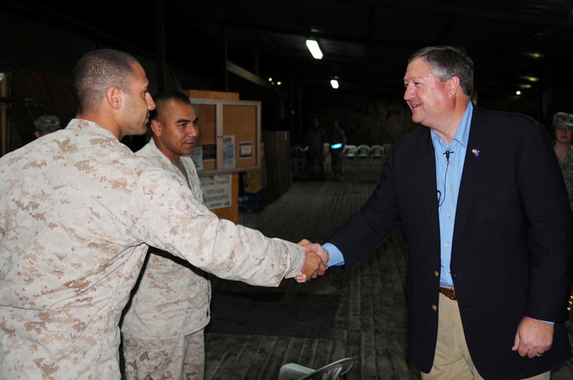 Secretary of the Air Force Michael B. Donley visits with Marines transiting through the base Oct. 15 at Manas Air Base, Kyrgyzstan. Manas AB was the final stop in the secretary's first trip to the U.S. Air Forces Central area of responsibility. (U.S. Air Force photo/Senior Airman Ruth Holcomb) 
