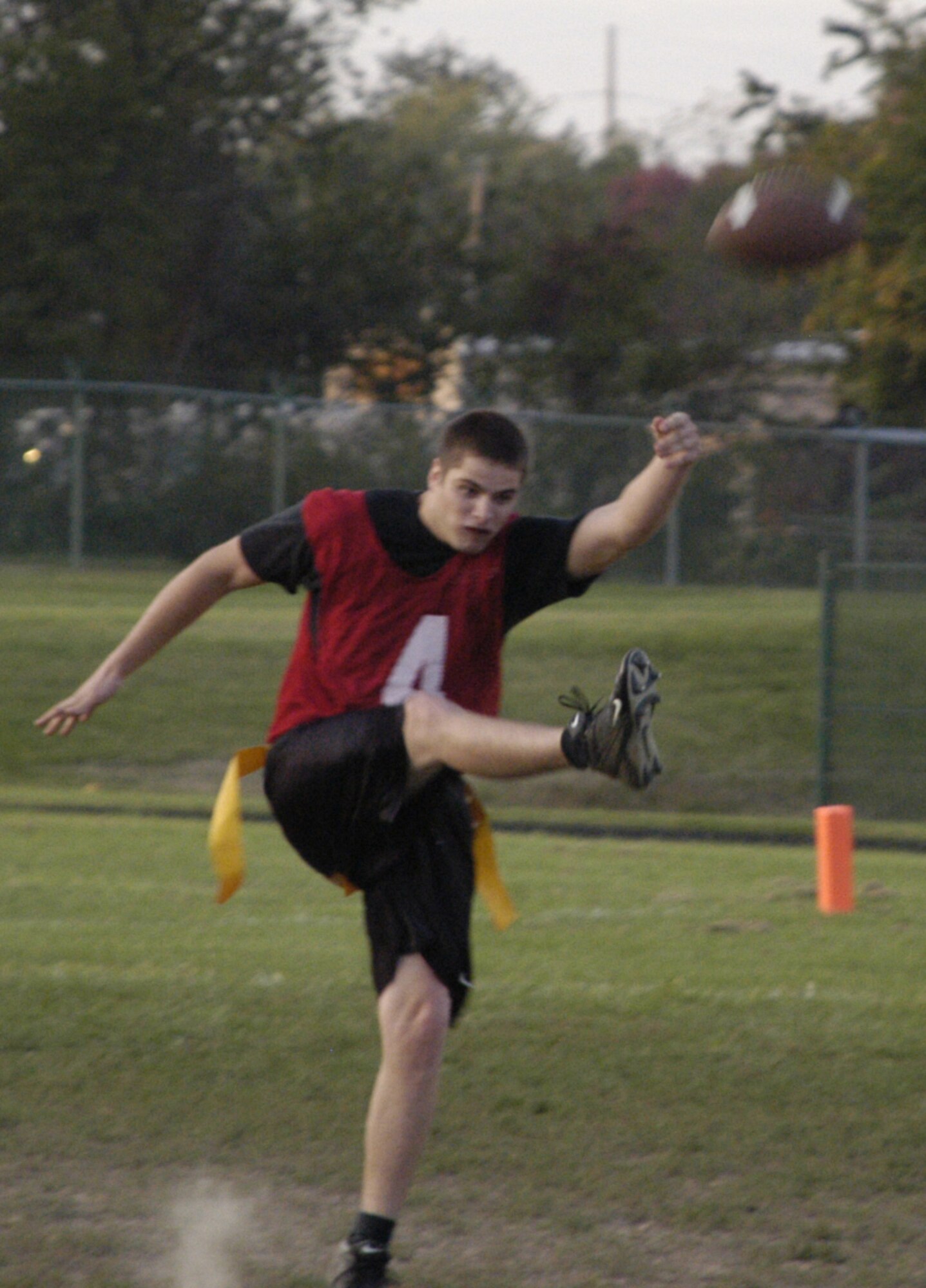 Blake Dempsey, OSS defensive lineman and kicker, punts the ball to start the second half.                        