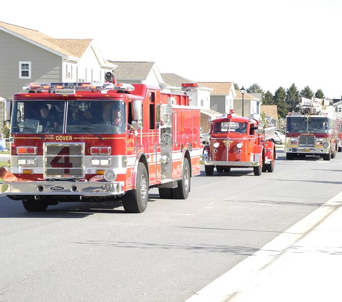 Fire trucks from Dover Air Force Base and six off base agencies participate in Dovers Fire Prevention week Parade Oct. 11. (U.S. Air Force photo by Staff Sgt. Chad Padgett)                       