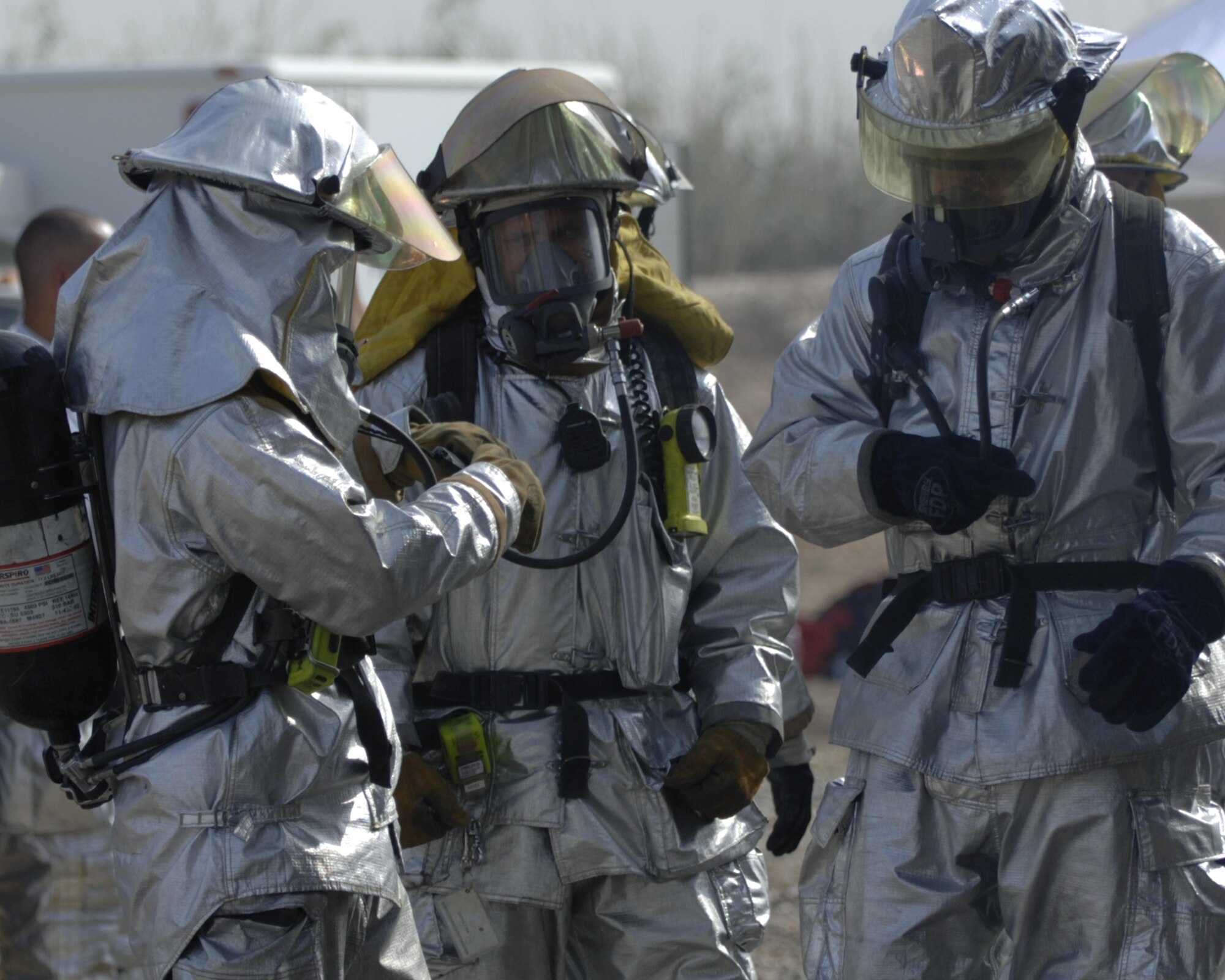 10/15/2008 ? SATHER AIR BASE, Iraq - Firefighters from the 447th Expeditionary Civil Engineer Squadron at Sather Air Base prepare to extinguish a structure fire during a live burn exercise. The unit is made up of Air National Guard Airmen who are responsible for fire protection and rescue operations for the base and airfield on the west side of Baghdad International Airport, one of the busiest aerial hubs in Iraq. (U.S. Air Force photo by Master Sgt. Brian Davidson)