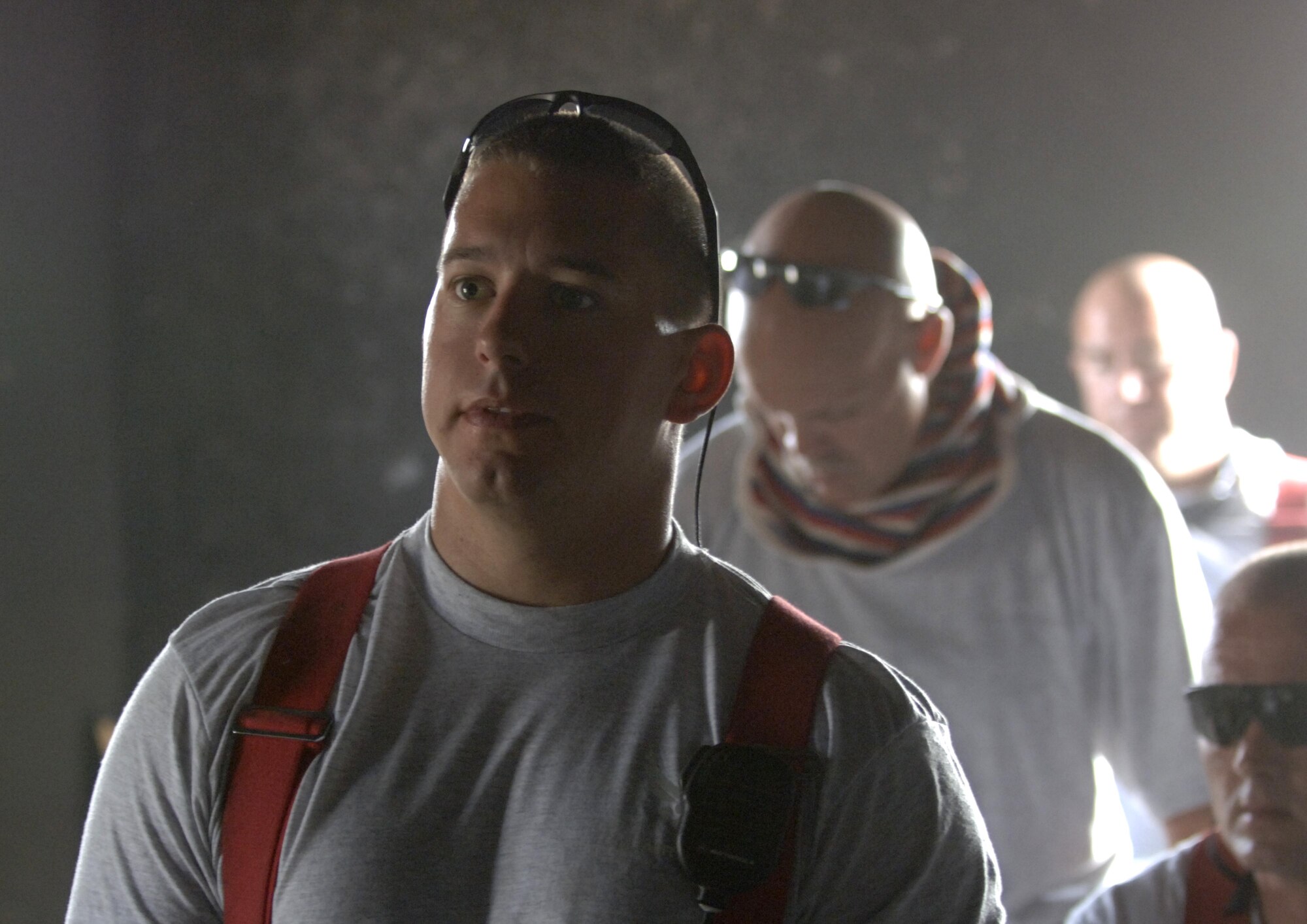 10/15/2008 ? SATHER AIR BASE, Iraq ? Staff Sgt. Jeffrey Daniels and fellow firefighters gather for safety and mission briefing in the burn building before a live burn exercise at Sather Air Base.  Sergeant Daniels is a New York Air National Guard firefighter deployed to the 447th Expeditionary Civil Engineer Squadron from the 105th Wing at Stewart Air National Guard Base. Sergeant Daniel?s unit is responsible for fire protection and rescue operations for the base and airfield on the west side of Baghdad International Airport, one of the busiest aerial hubs in Iraq. (U.S. Air Force photo by Master Sgt. Brian Davidson)