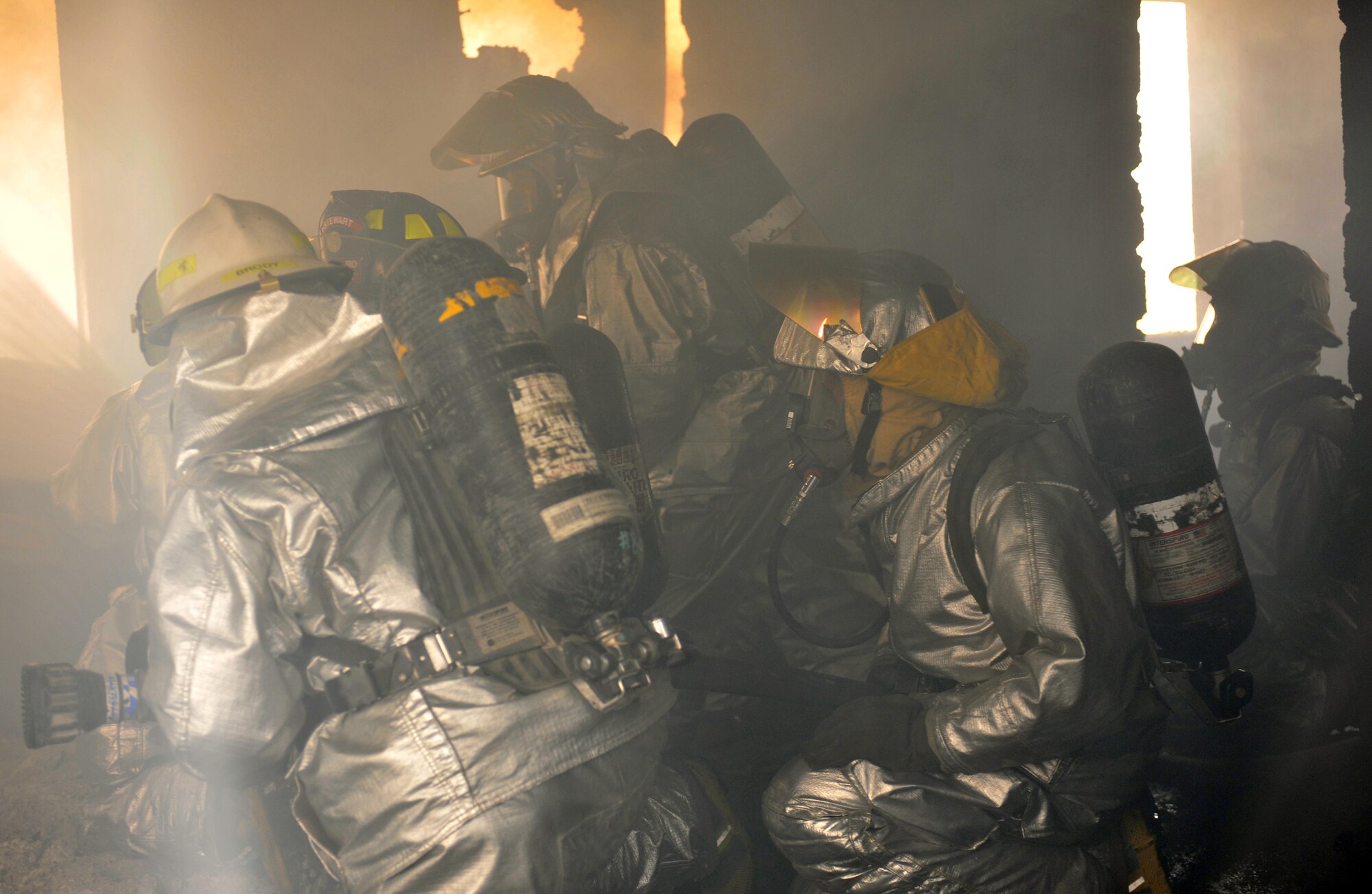 10/15/2008 ? SATHER AIR BASE, Iraq - Firefighters from the 447th Expeditionary Civil Engineer Squadron at Sather Air Base move in to extinguish a structure fire during a live burn exercise. The unit is made up of Air National Guard Airmen who are responsible for fire protection and rescue operations for the base and airfield on the west side of Baghdad International Airport, one of the busiest aerial hubs in Iraq. (U.S. Air Force photo by Master Sgt. Brian Davidson)