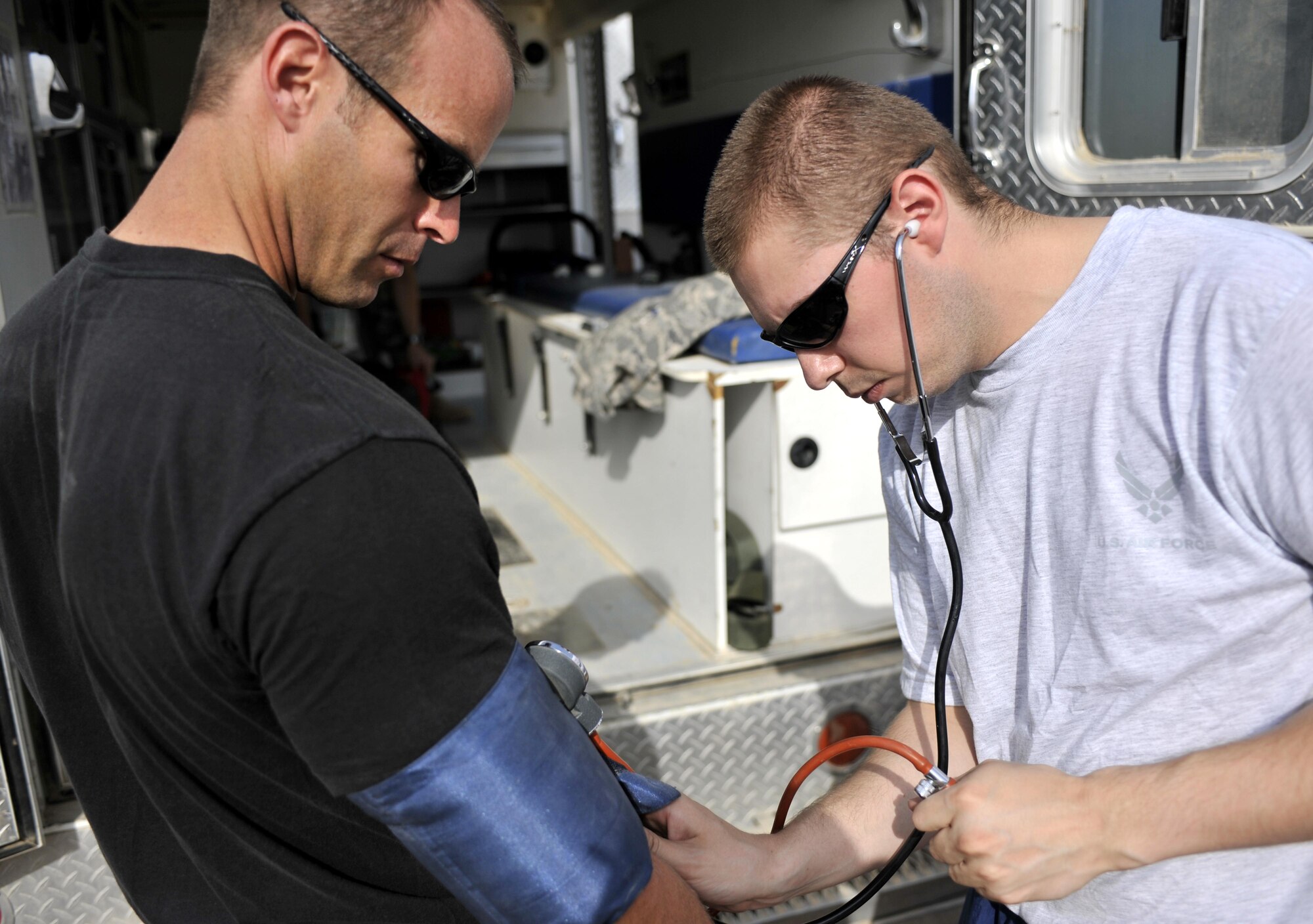 10/15/2008 ? SATHER AIR BASE, Iraq ?Staff Sgt. Andrew Love takes base-line vital signs on Staff Sgt. Chris Pieper before he dons his protective equipment and enters a burn building during a live burn exercise at Sather Air Base. Sergeant Love is a medic assigned to the 447th Expeditionary Medical Squadron and was responsible for monitoring the health of firefighters due to the extreme heat and stressful conditions they are exposed to during the training.  Sergeant Love is an Indiana Air National Guard Airmen deployed to Iraq from the 181st Medical Group in Terre Haute. Sergeant Pieper is assigned to the 447th Expeditionary Civil Engineer Squadron and is deployed from the North Dakota Air National Guard?s119th Wing  in Fargo. The Sather Firefighters and medics are responsible for fire protection, rescue operations and medical services for the base and airfield on the west side of Baghdad International Airport, one of the busiest aerial hubs in Iraq. (U.S. Air Force photo by Master Sgt. Brian Davidson)