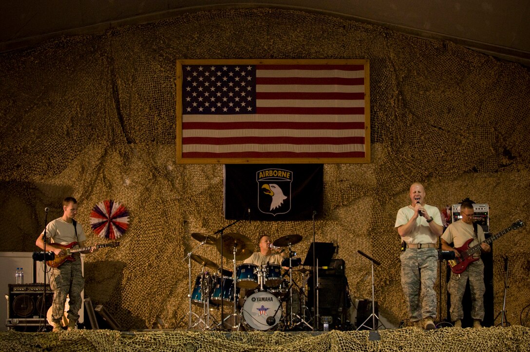 BAGRAM AIR FIELD, Afghanistan -- U.S. Air Forces Central band "Yuma" plays "Locked and Loaded" here Oct. 10. The song, an original composition for their next album, made its Afghan debut as the finale to their feature performance here at Bagram Air Field. Yuma continued on to play in Kabul before ending their tour in Afghanistan. (U.S. Air Force photo by Staff Sgt. Samuel Morse)