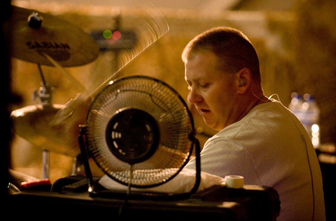 BAGRAM AIR FIELD, Afghanistan -- Tech. Sgt. Robert Smith, drummer for U.S. Air Forces Central band "Yuma," plays drum set here Oct. 10. Sergeant Smith previously served as a drummer for Naval musical ensembles such as the Navy Band Great Lakes in Waukegan, Ill., and Navy Band Northeast in Newport, R.I. (U.S. Air Force photo by Staff Sgt. Samuel Morse)