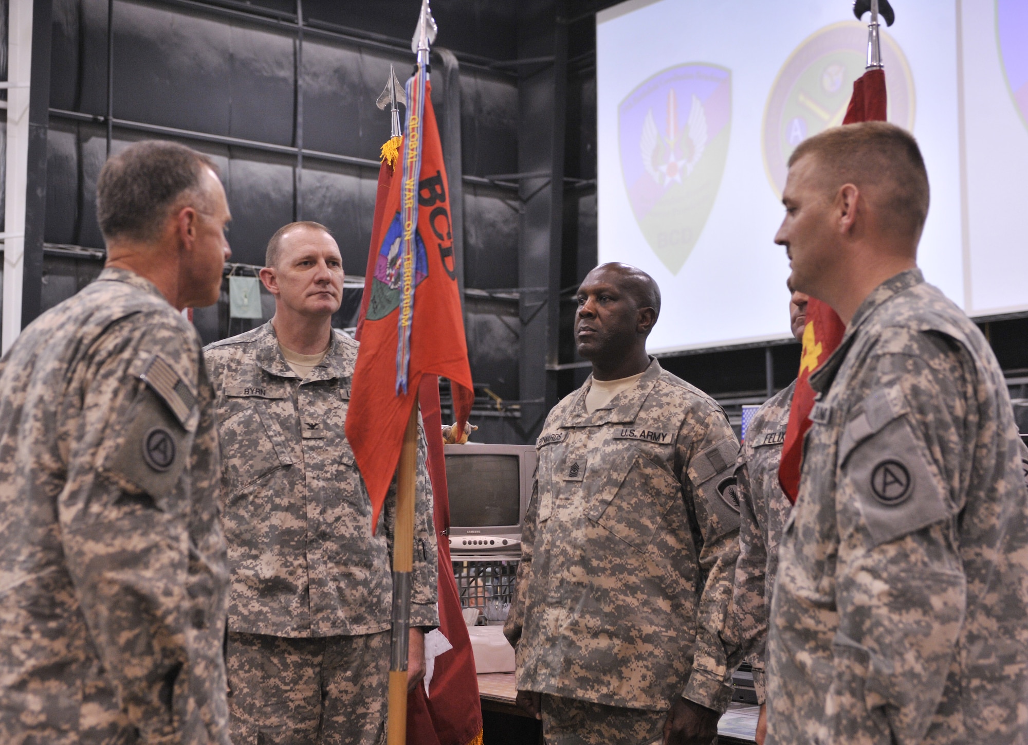 Army Lt. Gen. James J. Lovelace (left), Combined Forces Land Component commander and U.S. Army Central commander, presides over a transfer of authority ceremony at the Combined Air and Space Operations Center Oct. 15. The 4th Battlefield Coordination Detachment assumes authority from the 19th Battlefield Coordination Detachment and will serve as the liaison between the CFLCC and the Combined Forces Air Component Commander in the integration and synchronization of air power in direct support of maneuver forces in Iraq and Afghanistan. (U.S. Air Force photo by Staff Sgt. Aaron Allmon)