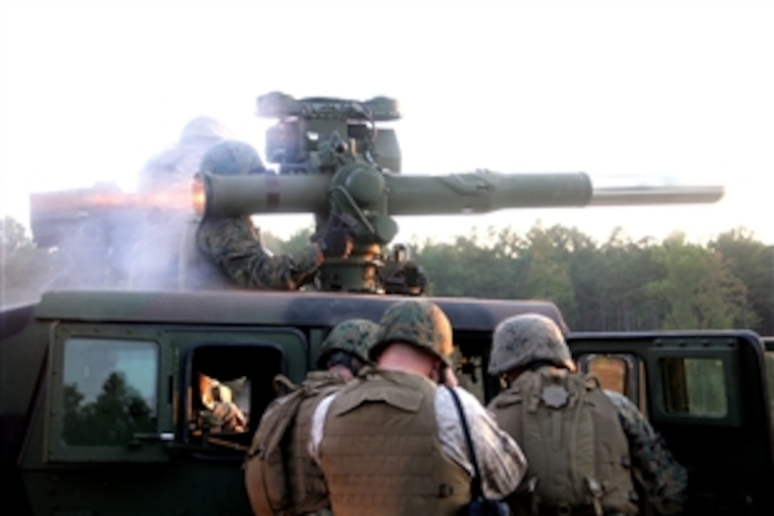 Flame spouts from an M-41 SABER missile launcher as Marines fire a Tube-launched, Optically tracked, Wire-command linked, guided missile, TOW, on Fort Pickett, Va., Oct. 5, 2008. The Marines are assigned to the Combined Anti-Armor Team, Weapons Company, Battalion Landing Team, 3rd Battalion, 2nd Marine Regiment, 22nd Marine Expeditionary Unit.