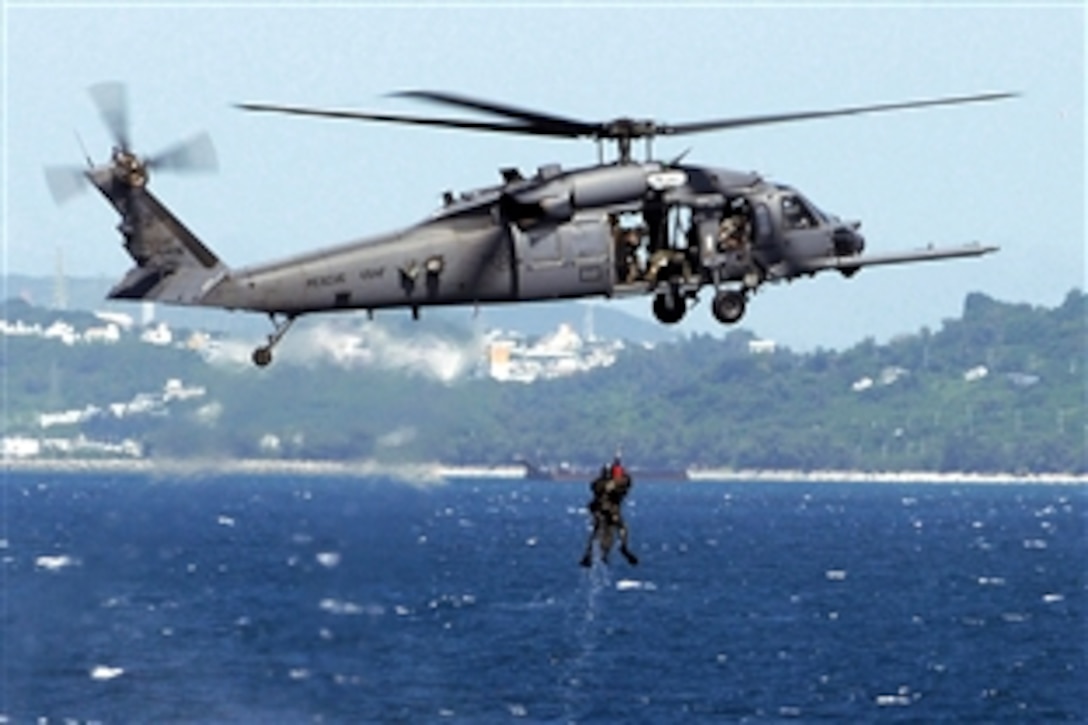 A U.S. Air Force aircrew on board an HH-60G Pave Hawk helicopter rescues one of two simulated downed pilots during a crisis management exercise off the coast of Okinawa, Japan, Oct. 8, 2008. Airmen assigned to the 33rd Rescue Squadron, 18th Wing, based on Kadena Air Base on Okinawa.
