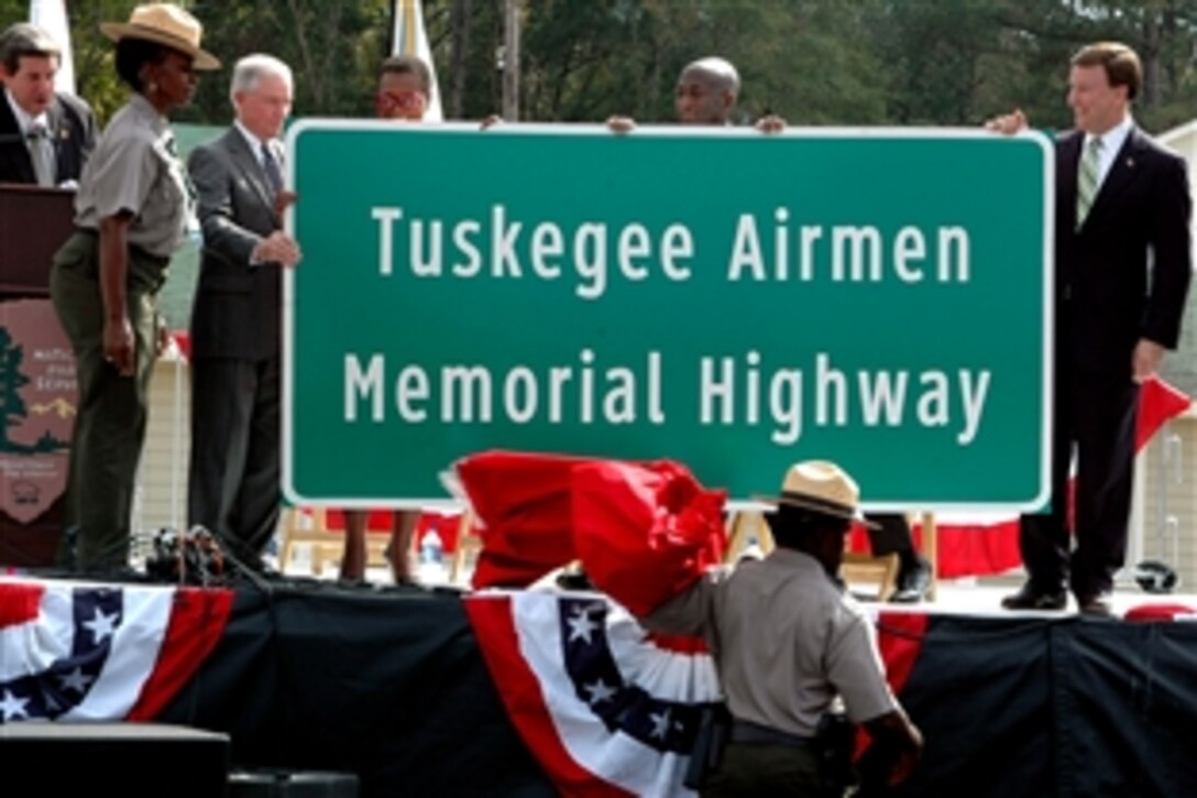 Alabama Gov. Bob Riley, left, announces a portion of the I-85 interstate as the Tuskegee Airmen Memorial Highway as part of the National Park Services ceremony dedicating Moton Field - the Tuskegee Airmen's original training grounds - a national historic site,Tuskegee Ala., Oct. 10, 2008.