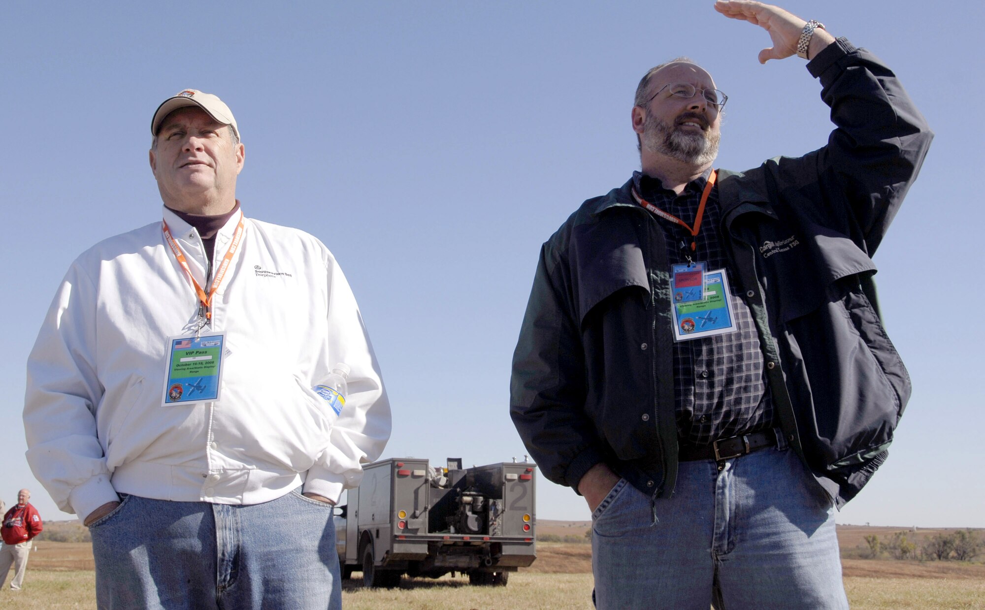 Former Marine Aaron White (right) reminisces about the day when he called for air support and was surprised to see an A-10 Thunderbolt II suddenly appear. Larry Powell, a fellow Salina city council member, intently listened as A-10s flew overhead. Fourteen A-10 squadrons from across the Air Force are competing in Hawgsmoke 2008 Oct. 14 to 18.  Hawgsmoke is a biennial A-10 bombing and aerial gunnery competition, which was hosted this year by the Air Force Reserve Command's 442nd Fighter Wing based at Whiteman Air Force Base, Mo.  (U.S. Air Force photo/Staff Sgt. Kent Kagarise)