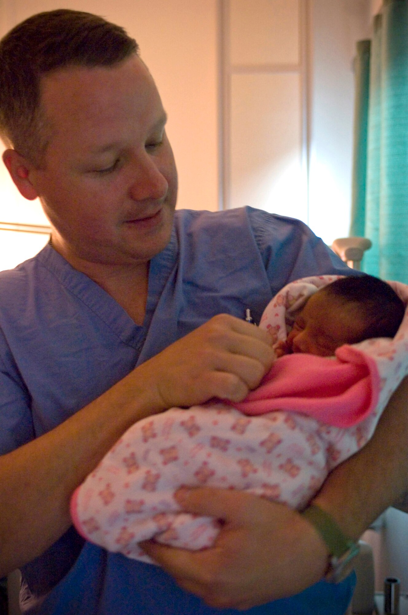 Capt. (Dr.) Brian Hearn checks on Zahra, the first Afghan baby born in the Craig Joint Theater Hospital at Bagram Airfield, Afghanistan, Oct. 8. Although he is deployed to work as a general physician and surgeon, Doctor Hearn, like many of the hospital staff members, is using his home-station experience to help care for the newborn. Doctor Hearn is an obstetrics/gynecology physician. (U.S. Air Force photo/Staff Sgt. Rachel Martinez)