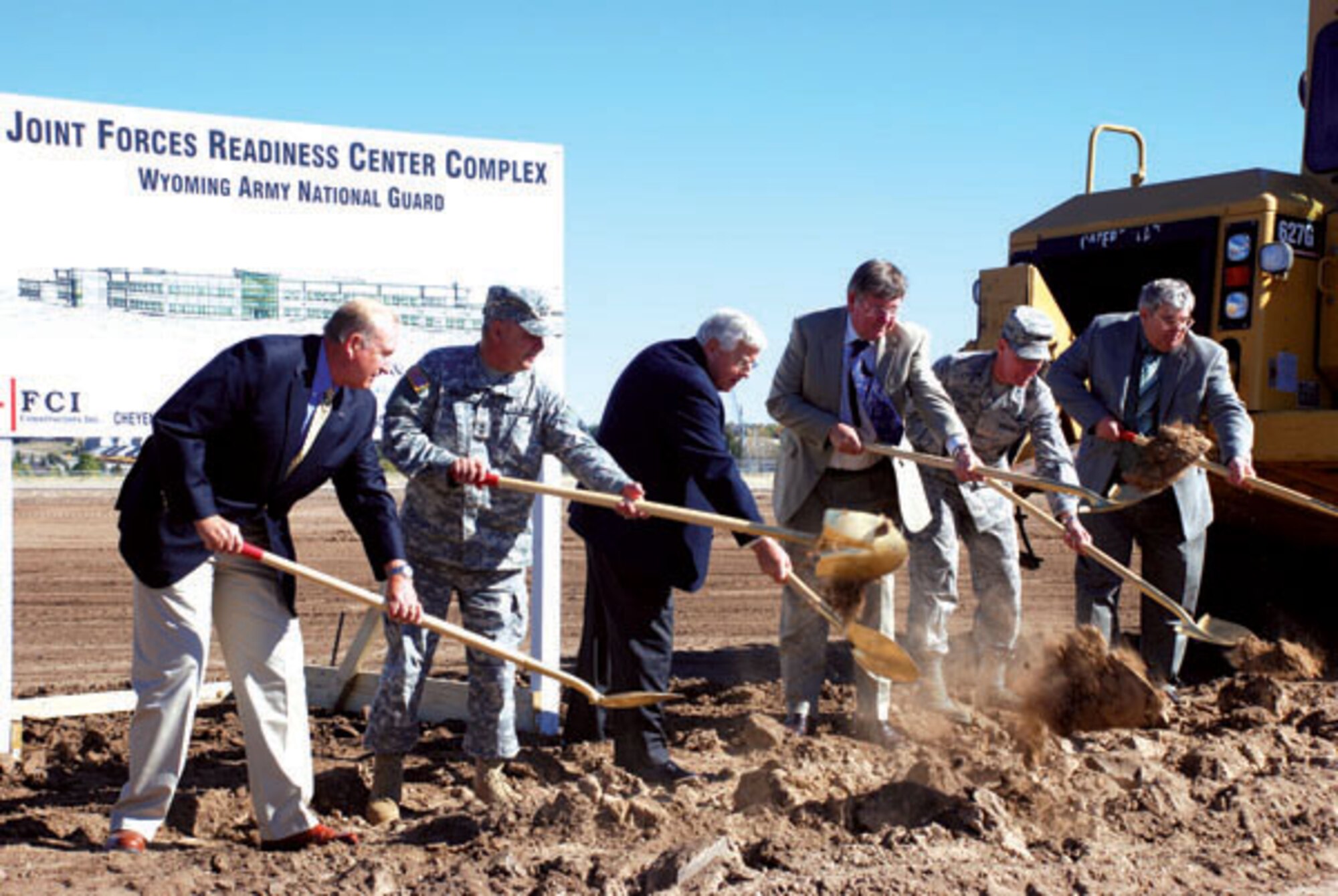 WYOMING ANG DIGS IN

F. E. WARREN AIR FORCE BASE, Wyo. -- Carl Willard, National Guard Bureau ARI (Army Installations) BRAC field support team leader, Maj. Gen. Ed Wright, Wyoming’s adjutant general, Senator Mike Enzi, Gov. Dave Freudenthal, Col. Mike Morgan, 90th Missile Wing commander and Doug Shope, Wyoming assistant adjutant general, ceremonially break ground Oct. 8 on the Wyoming National Guard’s Joint Forces Readiness Center on base.

“The joint aspect of F.E. Warren Air Force Base continues to increase,” said Col. Tammy Maas, Wyoming Army National Guard Construction and Facilities manager. “Colonel Mike Morgan has been a vocal advocate of the joint military might we bring to the base. His support ensures the Wyoming National Guard’s partnership with the U.S. Air force continues to flourish.”

The $34.7 million project is part of the 2005 base realignment and closure process and is the second of two BRAC-funded projects the Wyoming National Guard is constructing on base. The first, a $44 million Army Aviation Support Facility, began November 2007 and both projects should be complete by 2010.
