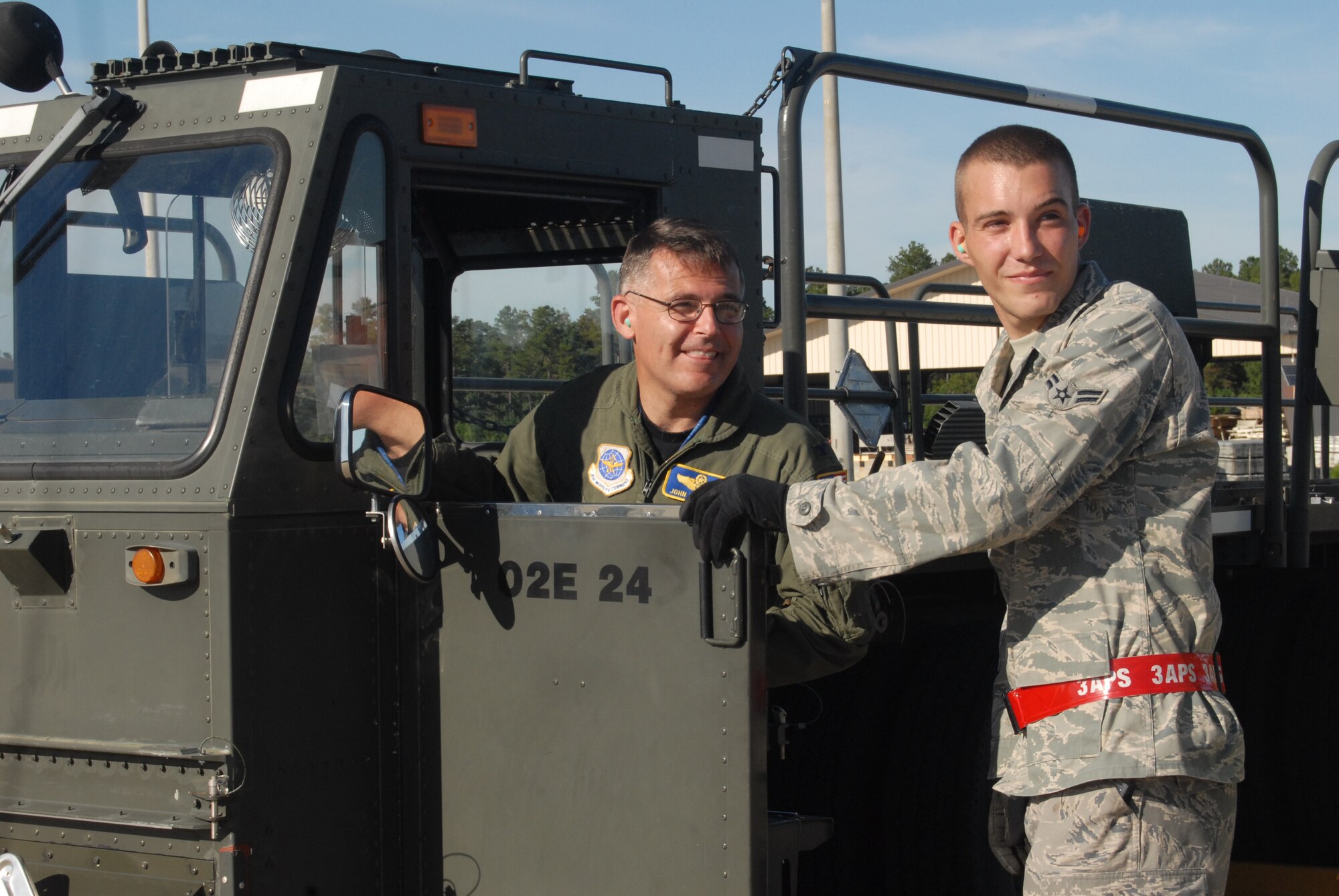 Col. John McDonald, 43rd Airlift Wing Commander, listens as Airman 1st Class Robert Dudley, 3rd Aerial Port Squadron, instructs him on the proper procedures for driving a 60K loader on the flightline Tuesday. (U.S. Air Force Photo by Master Sgt. VIcki Johnson)