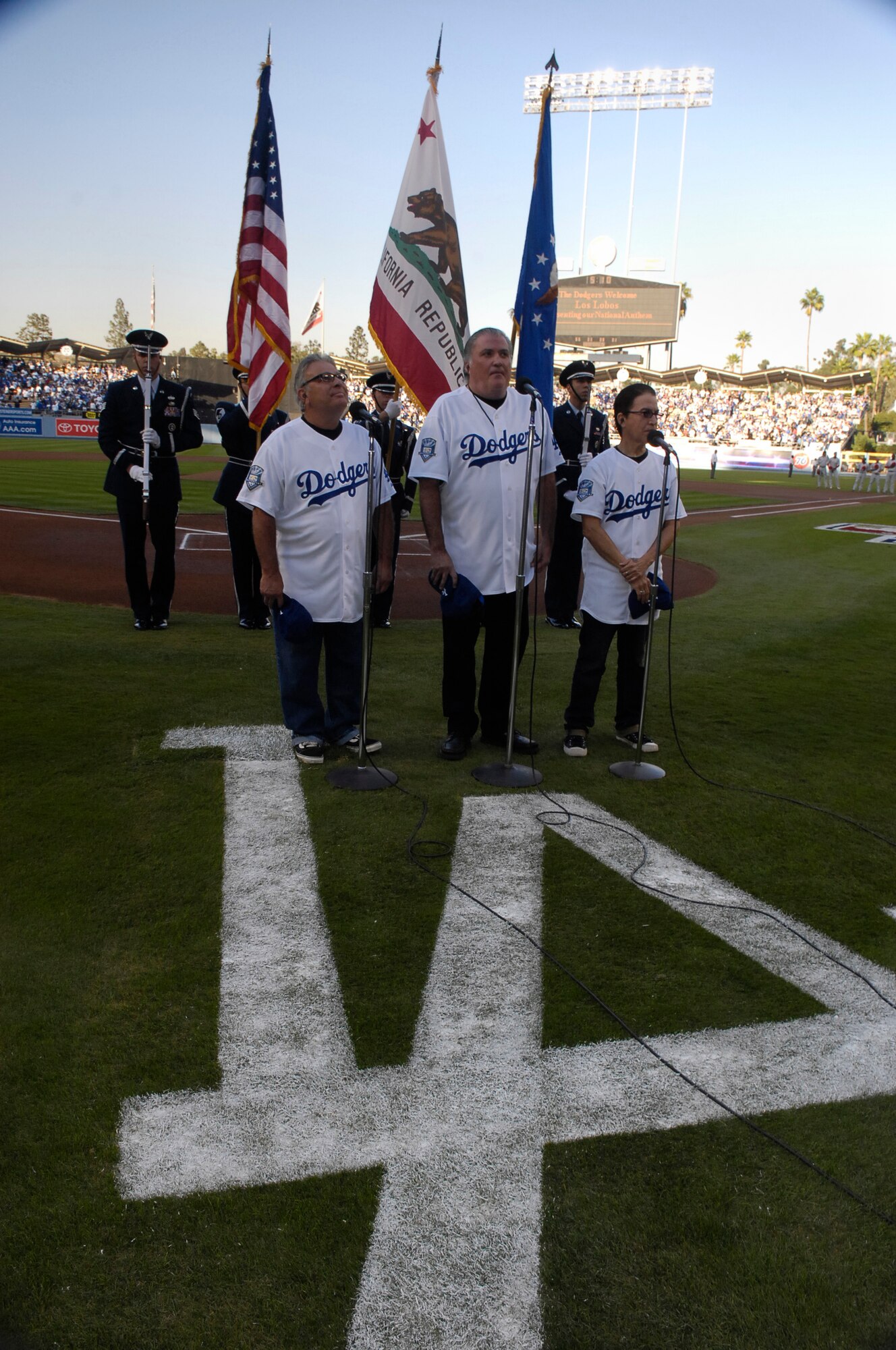 VANDENBERG AIR FORCE BASE, Calif.-- Three-time grammy award winning artists Los Lobosperform the National Anthem as members of the Vandenberg Honor Guard present the colors during the opening ceremony at Game 4 of the National League Championship Series. The Los Angeles Dodgers were defeated 7-5 by the Philadelphia Phillies at Dodger Stadium, Oct. 13. (U.S. Air Force Photo/Staff Sgt. Vanessa Valentine) 