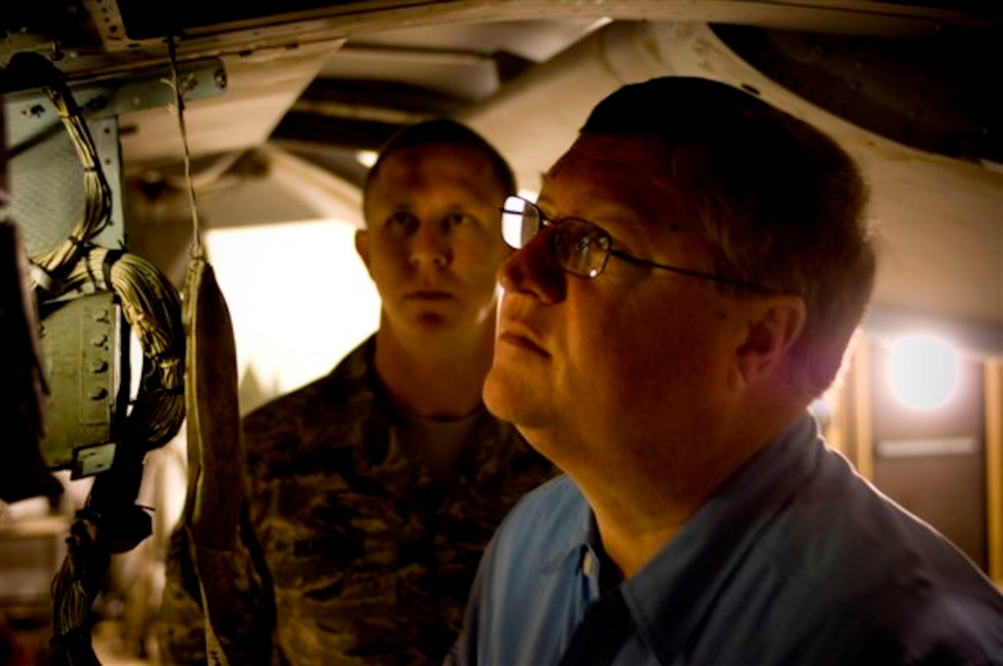 Secretary of the Air Force Michael B. Donley gets an up-close look at an A-10 Thunderbolt II Oct. 15 during his visit to Bagram Airfield, Afghanistan. Secretary Donley met with the A-10 maintenance unit to hear about how the maintainers are keeping this aged bird in the fight. (U.S. Air Force photo/Staff Sgt. Samuel Morse)