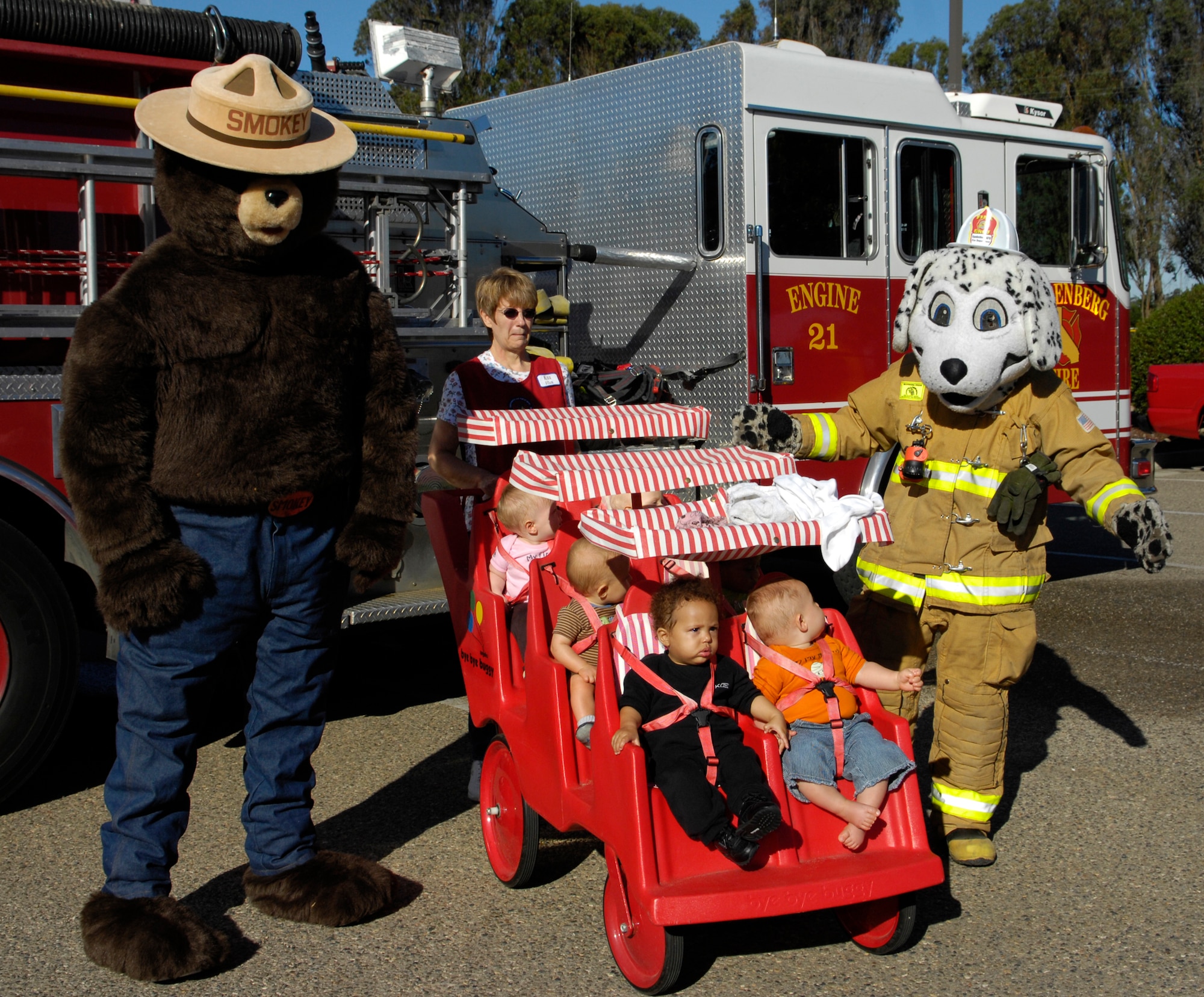 VANDENBERG AIR FORCEBASE, Calif.-- Children from the Child Development Center take pictures with Smokey The Bear and Sparky The Dog here Oct. 7. The Vandenberg Hotshots stopped at the CDC as part of Fire Prevention Week.  (U.S. Air Force Photo/ by Airman 1st Class Andrew Lee)