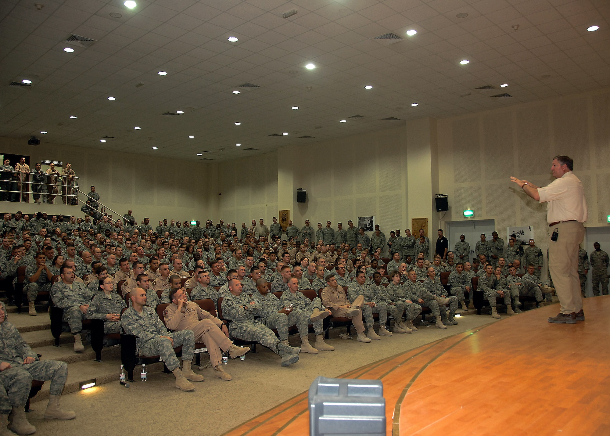 386th Air Expeditionary Wing Airmen listen as Secretary of the Air Force Michael B. Donley talks to them about the future of the Air Force Oct. 14 at an air base in Southwest Asia. Secretary Donley visited with Airmen from the 386th Air Expeditionary Wing, coalition partners and sister services during his visit. (U.S. Air Force photo/Tech. Sgt. Raheem Moore)