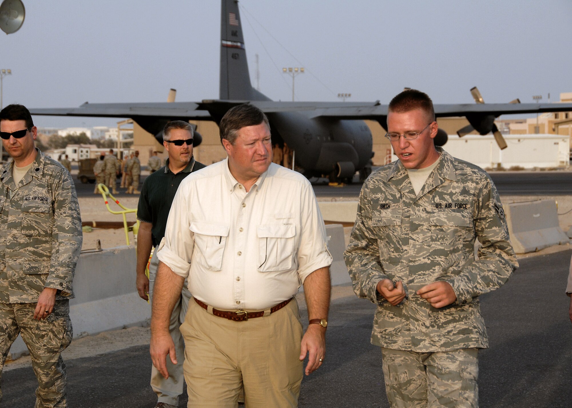 Airman 1st Class Paul Smith briefs Secretary of the Air Force Michael B. Donley on the flightline fuels storage area Oct. 14 at an air base in Southwest Asia. Secretary Donley visited with Airmen from the 386th Air Expeditionary Wing, coalition partners and sister services during his visit. Airman Smith is a 386th Expeditionary Logistics Readiness Squadron fuels technician. (U.S. Air Force photo/Tech. Sgt. Raheem Moore)