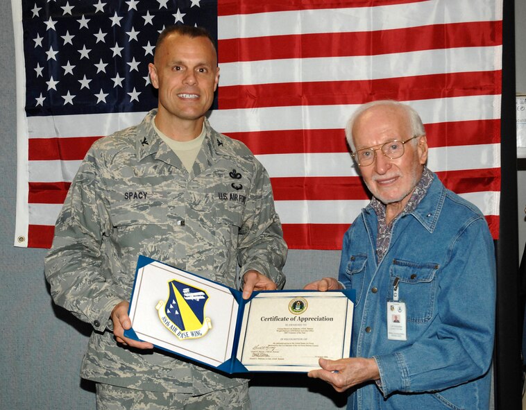 Col. Bradley Spacy, 88th Air Base Wing commander, presents retired Col. Byron Lee Schatzley with the Wright-Patterson Air Force Base Retiree Activities Office Volunteer of the Year Award on Oct. 16.  Col. Schatzley, a Beavercreek Township, Ohio resident, previously directed the base's Retiree Activities Office and continues to volunteer.  The Retiree Activities Office provides information to military retirees, their dependents and survivors, and also coordinates retiree volunteer assistance across the installation. (U.S. Air Force photo/Al Bright)
