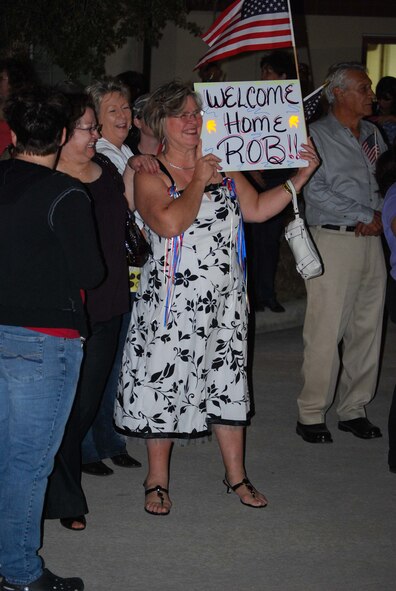 About 110 Airmen from the 556th REDHORSE Squadron returned from deployment on Sunday, October 12, 2008. When the Reserve Airmen arrived home, about 300 friends, family and unit members were there to welcome them with hugs and hand-made banners. REDHORSE is an acronym for Rapid Engineer Deployable Heavy Operational Repair Squadron Engineers. The REDHORSE Airmen deployed to three different countries within the U.S. Central Command Area of Responsibility. During the deployment, they dug wells for Afghanis, repaired existing structures in Iraq and supported base construction and repair needs throughout the AOR. The 556th REDHORSE Squadron is due to relocate to Florida later this year but many of the Reservists will remain at Lackland Air Force Base as new members of the 433rd Civil Engineer Squadron. (U.S. Air Force Photo/Master Sgt. Collen McGee)