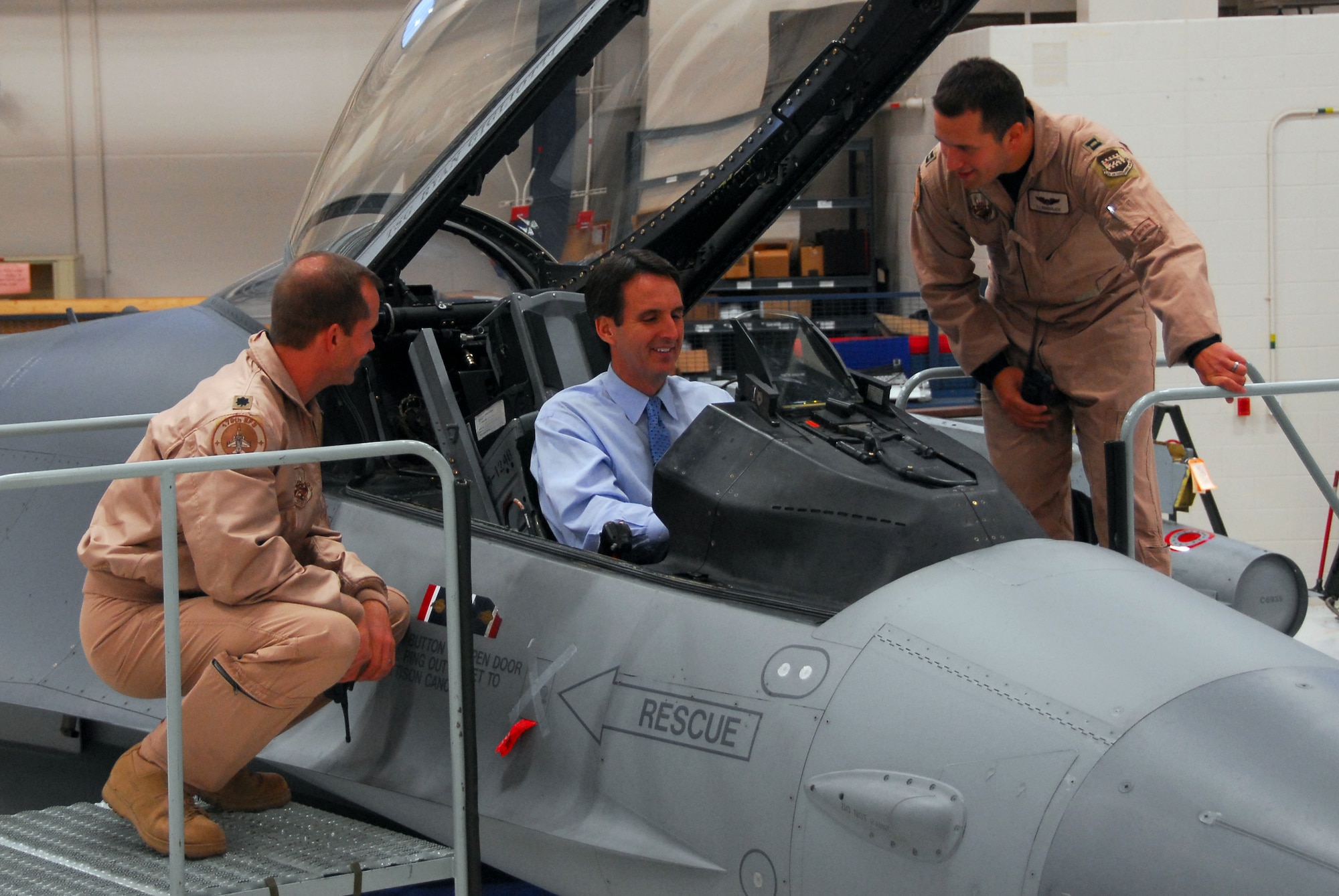 148th Fighter Wing pilot Capt. Thomas Rendulich (right) and Lt. Col. Tim Peterson  give an overview of the cockpit of an F-16 Fighting Falcon to Minn. Governor Tim Pawlenty in Duluth, Minn October 16, 2008.  (U.S. Air Force photo by TSgt Jason Rolfe) (Released)