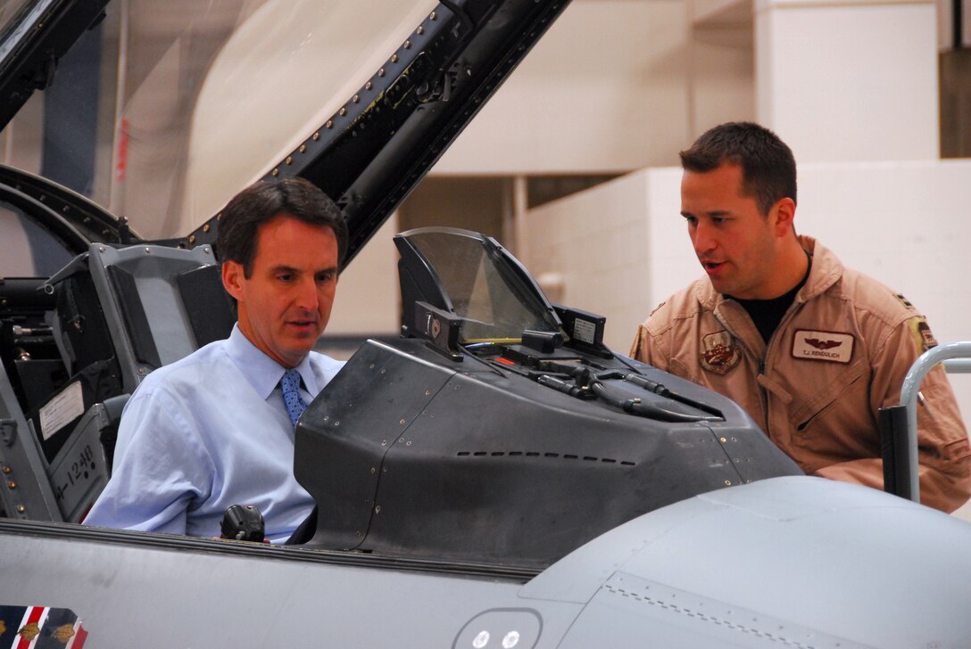 148th Fighter Wing pilot Capt. Thomas Rendulich explains about the cockpit of an F-16 Fighting Falcon to Minn. Governor Tim Pawlenty in Duluth, Minn October 16, 2008.  (U.S. Air Force photo by TSgt Jason Rolfe) (Released)