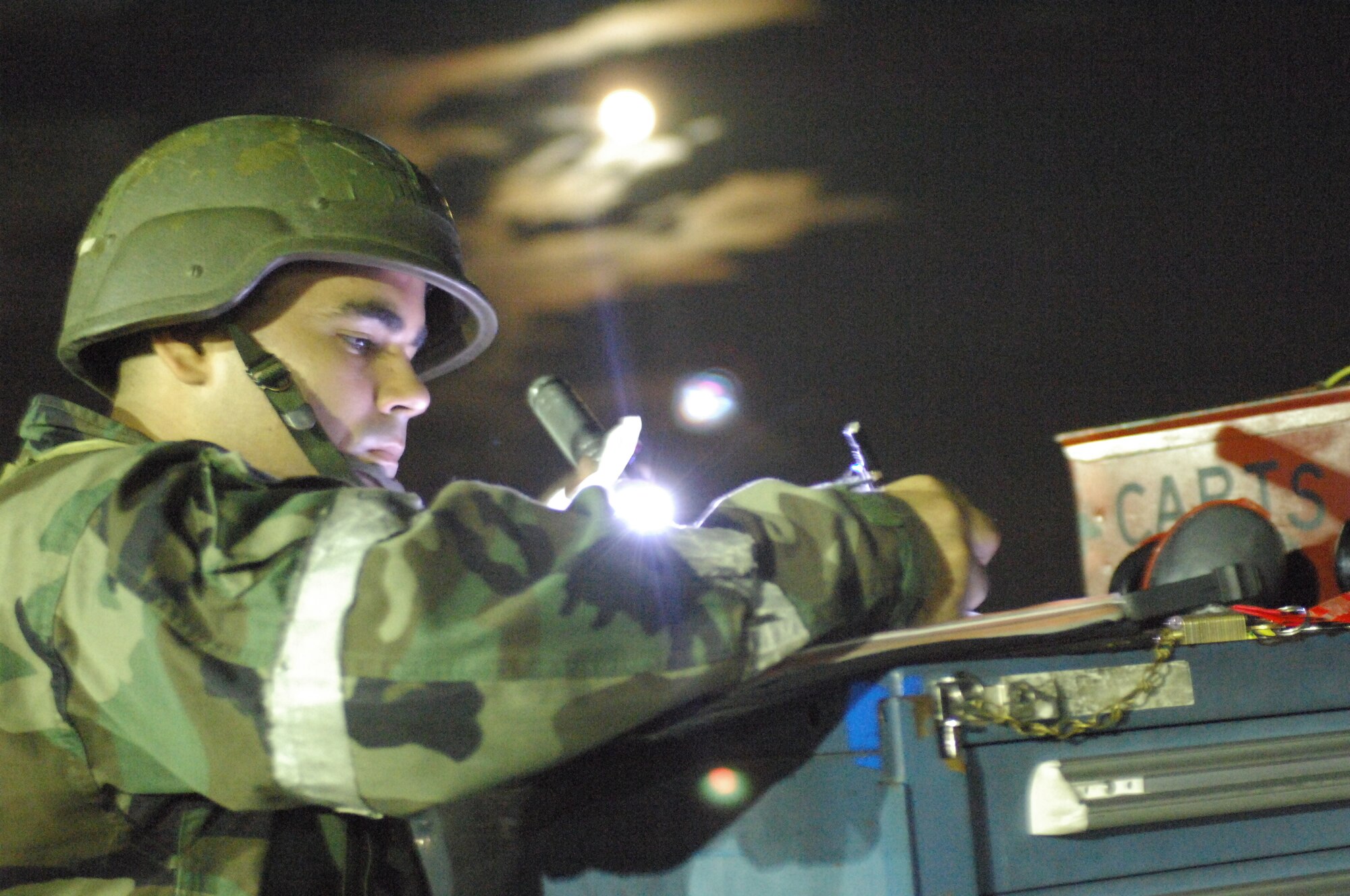 SHAW AIR FORCE BASE, S.C. -- Staff Sgt. Paul Fletcher, 79th Aircraft Maintenance Unit, signs off 370 gallon fuel tanks for a simulated external fuel tank jettison during a Phase II Operational Readiness Exercise Oct. 16. OREs evaluate how quickly and accurately Airmen can prepare aircraft in deployed locations. (U.S. Air Force photo/Senior Airman William Coleman)