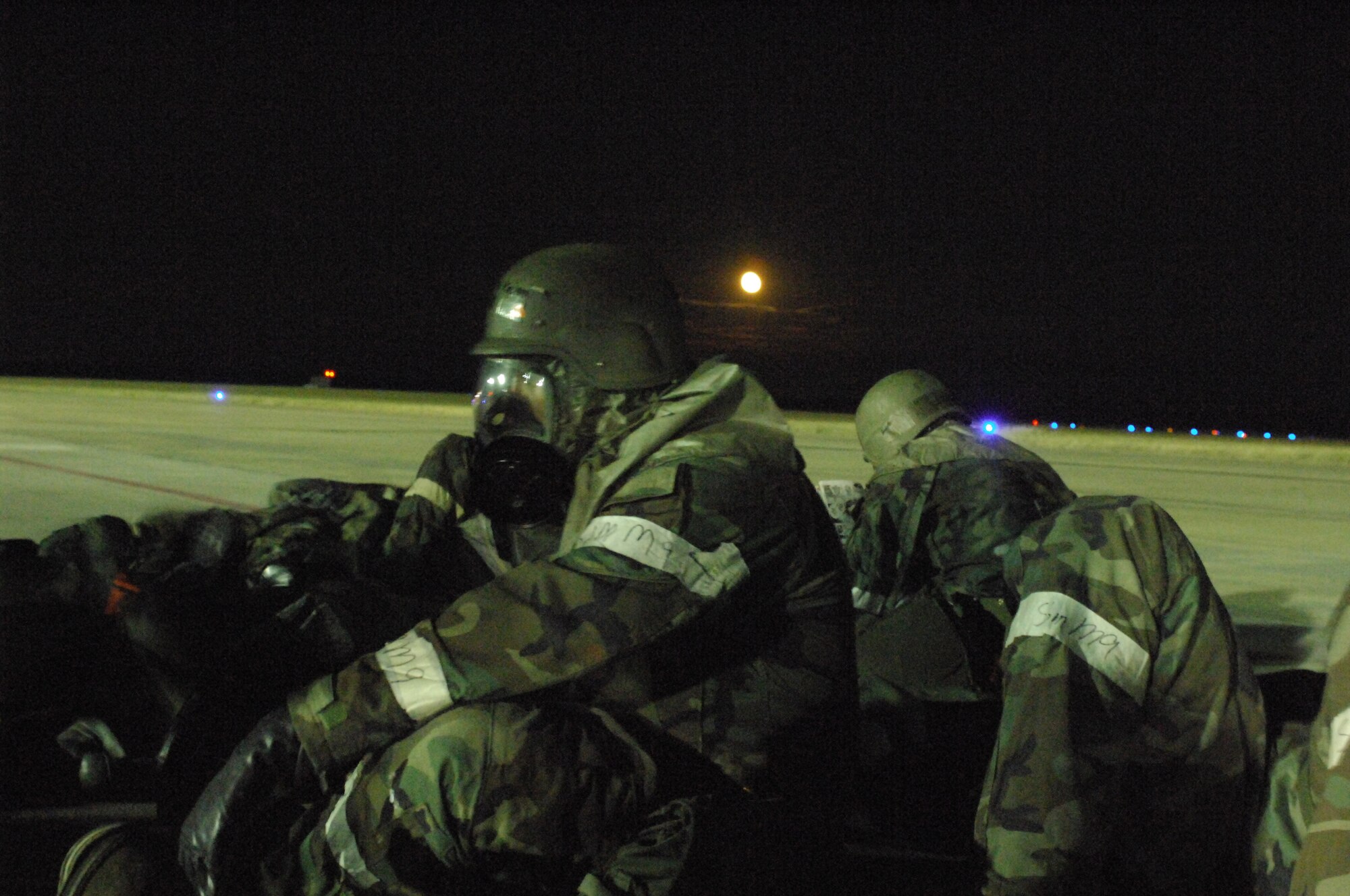 SHAW AIR FORCE BASE, S.C. -- Airmen from the 79th Maintenance Unit respond to an alarm red MOPP 4 ground attack while on the flightline during a Phase II Operational Readiness Exercise Oct. 16. OREs evaluate how quickly and accurately Airmen can prepare aircraft in deployed locations. (U.S. Air Force photo/Senior Airman William Coleman)