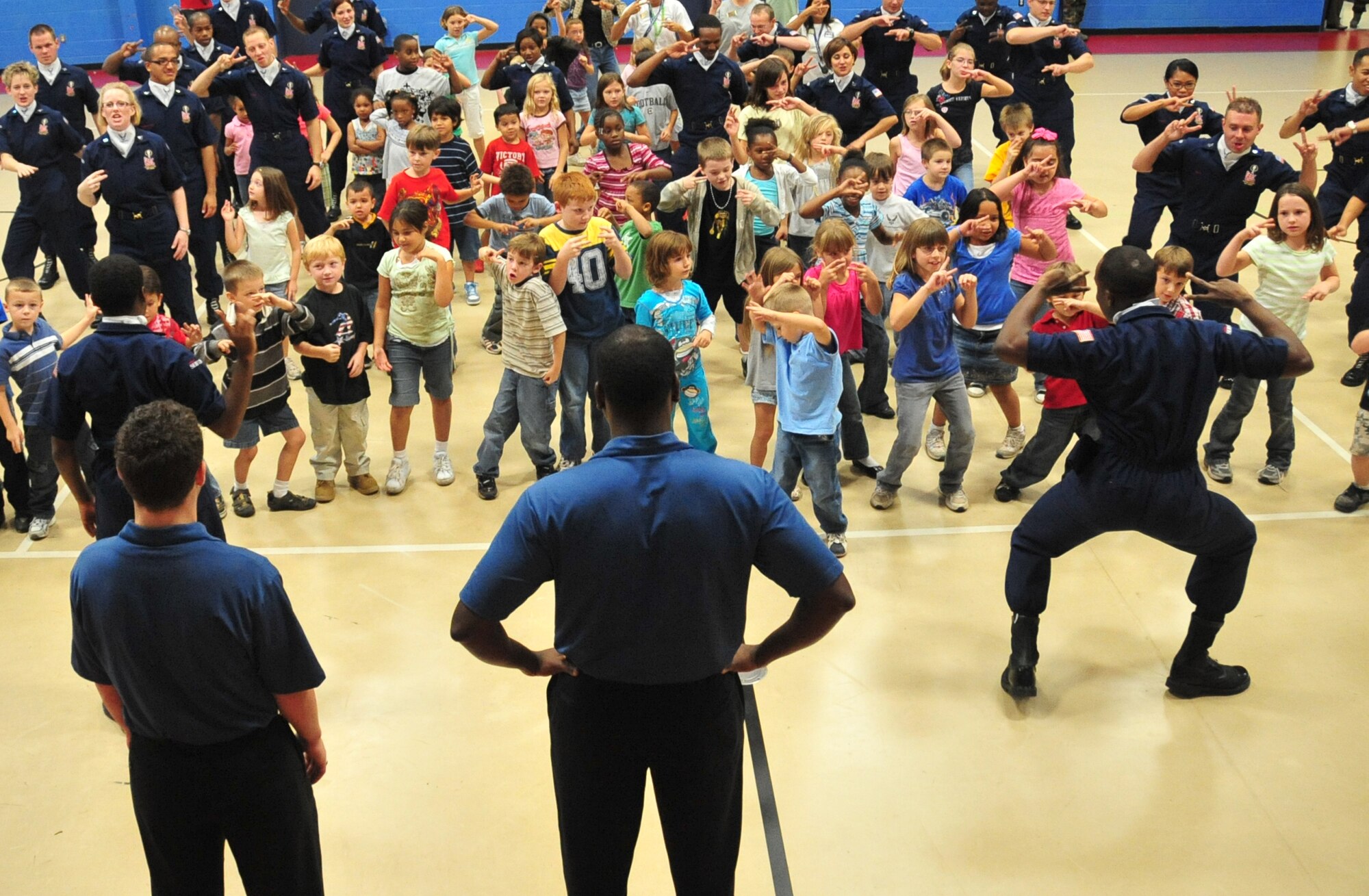 SHAW AIR FORCE BASE, S.C. -- Tops in Blue Airmen take time out to perform for Shaw youth Oct 17. Tops in Blue serves as an expeditionary entertainment unit to provide quality entertainment from within Air Force resources for the Air Force family, with priority to Air Force personnel stationed worldwide at remote and deployed locations while simultaneously promoting community relations, supporting recruiting efforts and serving as ambassadors for the United States of America and the United States Air Force. (U.S. Air Force photo/Staff Sgt. Patrick Mitchell)