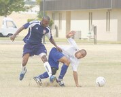 10/12/2008 - Mel McBean fights Raul Diaz-Funes, Eglin Air Force Base, Fla., for control of the ball during the Defender Cup championship Monday at the Warhawk Field. Eglin beat Lackland 3-1 by taking advantage of penalty kick opportunities that created two goals. (USAF photo by Alan Boedeker)                              