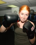 10/6/2008 - Chelsea Foulks warms up before the mixed martial arts class she teaches at the Warhawk Fitness Center. (USAF photo by Alan Boedeker)                          