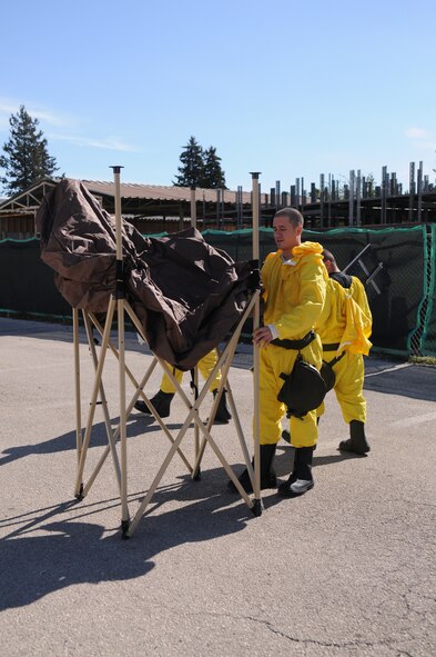 During a recent Readiness Support Team training, Airman 1st Class Ryan Yarcho, 39th Communications Squadron,  builds a containment hamper.  During exercises and real-world contingencies, these hampers are a vital part to the decontamination stations.