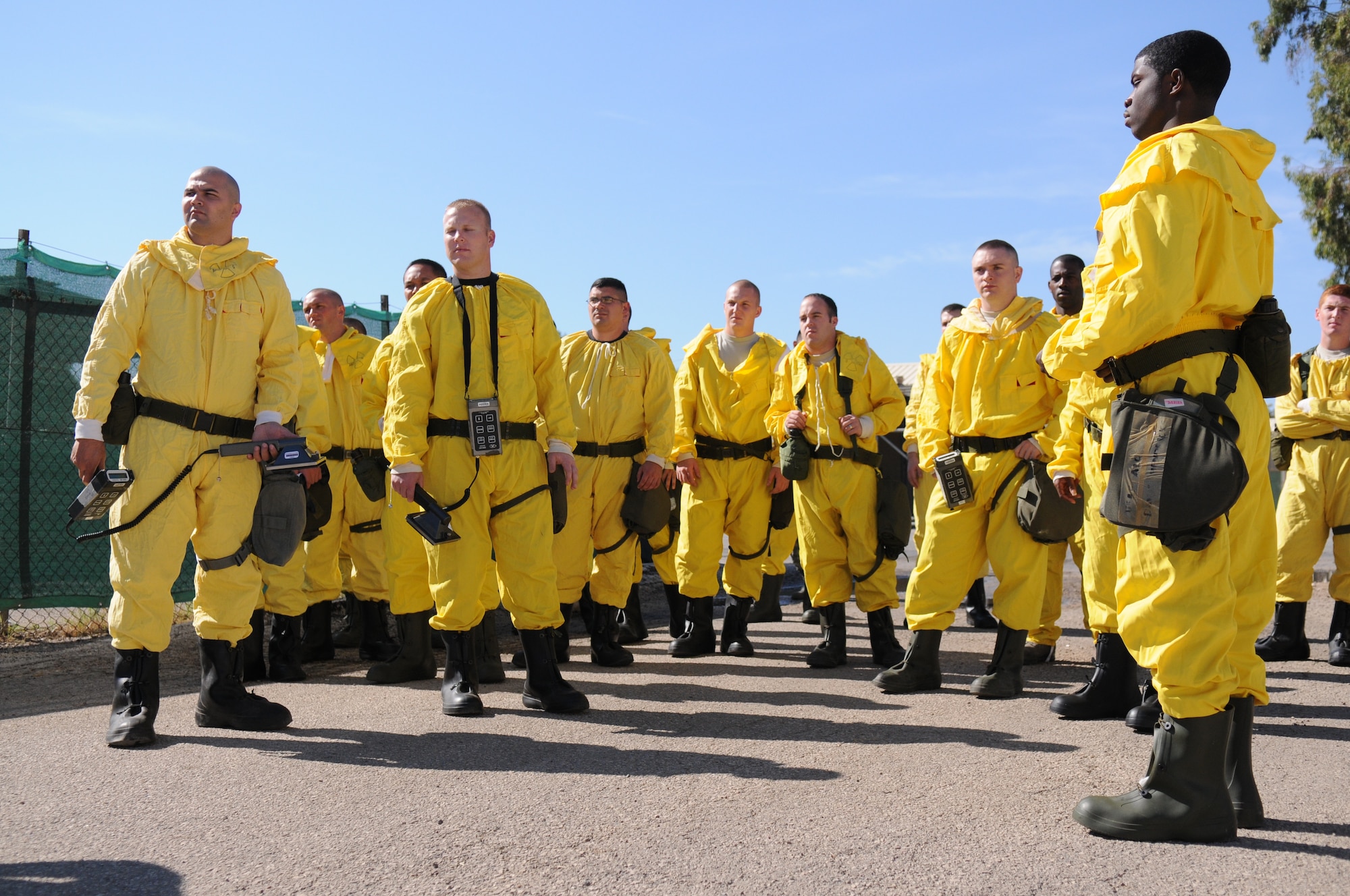 Readiness Support Team members listen to instructions on setting up a Contamination Control Station.  Members of RST attend monthly trainings to prepare for real-world emergencies.