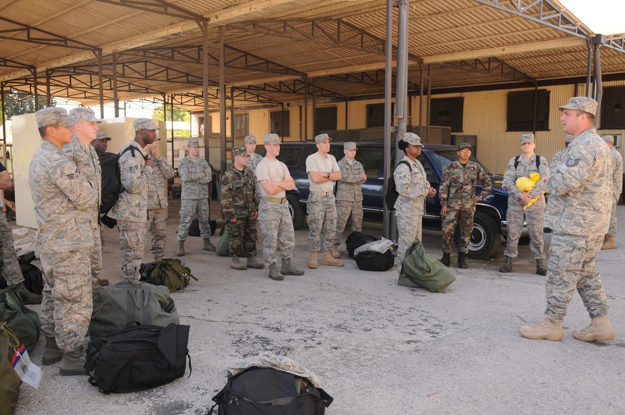 Tech Sgt. Scott Cooper, 39th Civil Engineer Squadron, Readiness and Emergency Management Flight, briefs the Readiness Support Team plans for training.  Members usually carry their mobility bags, gas masks, and a contamination suit, aka banana suit.